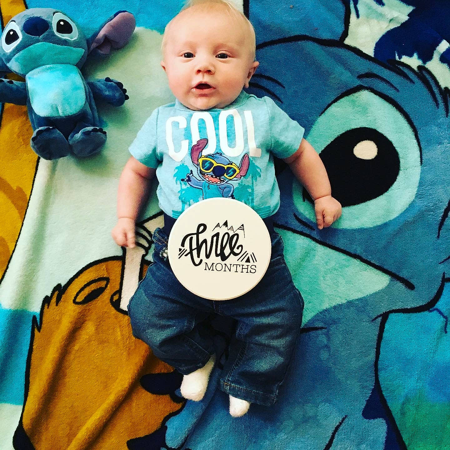 Lucas is registered to the contest to win money with this photo: animated_cartoon, baby, blue, cartoon, child, cool, fictional_character, happy, illustration, person, plush, product, sleeve, stuffed_toy, t_shirt, toddler, toy, turquoise