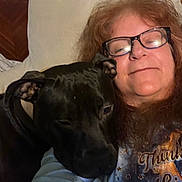 Snoop is registered to the contest to win money with this photo: affection, casual, closeup, comfort, companion, couch, dog, friendly, glasses, hair, happy, indoor, pet, pillow, portrait, relaxed, resting, smile, tshirt, woman