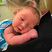 Mason is registered to the contest to win money with this photo: newborn, baby, infant, shoulder, holding, portrait, face, hair, arm, blanket, striped_blanket, resting, sleeping, cozy, indoor, caregiver, skin, closeup, family, hospital