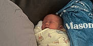 Mason joined the competition — help win amazing prizes! baby, newborn, sleeping, swaddled, blanket, blue_blanket, personalized_blanket, winnie_the_pooh_print, tiger_print, pacifier, sofa, leather_sofa, pillow, cushion, cozy, indoors, portrait, fabric, soft_lighting, peaceful