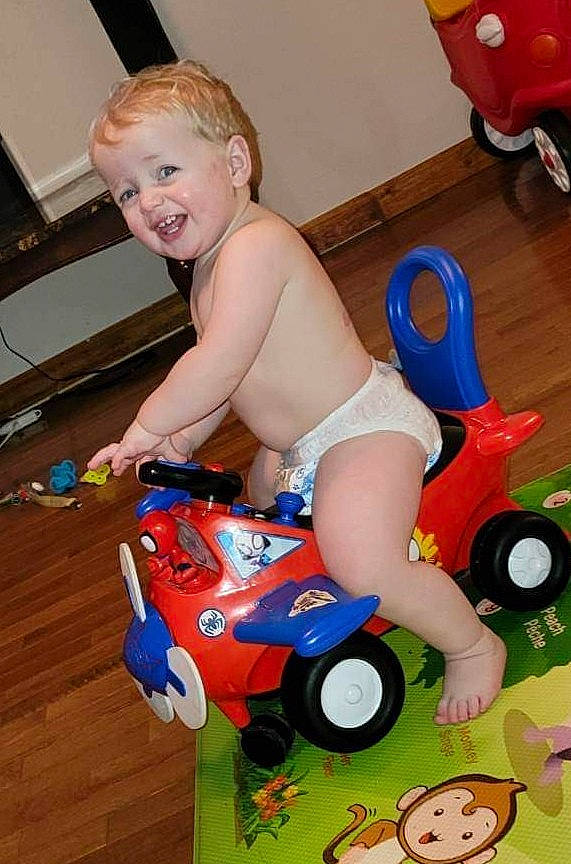 Kash joined the competition — help win amazing prizes! automotive_wheel_system, baby_playing_with_toys, baby_products, baby_toys, child, electric_blue, fun, grass, happy, person, plastic, play, product, riding_toy, smile, tire, toddler, toy, toy_vehicle, vehicle