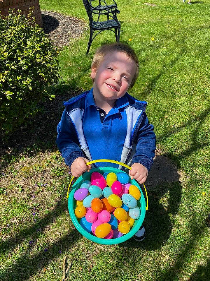 Isaac is registered to the contest to win money with this photo: ball, basket, chair, child, easter, easter_egg, electric_blue, event, fun, grass, happy, joy, leisure, people_in_nature, person, recreation, sitting, smile, sports_toy, sweetness