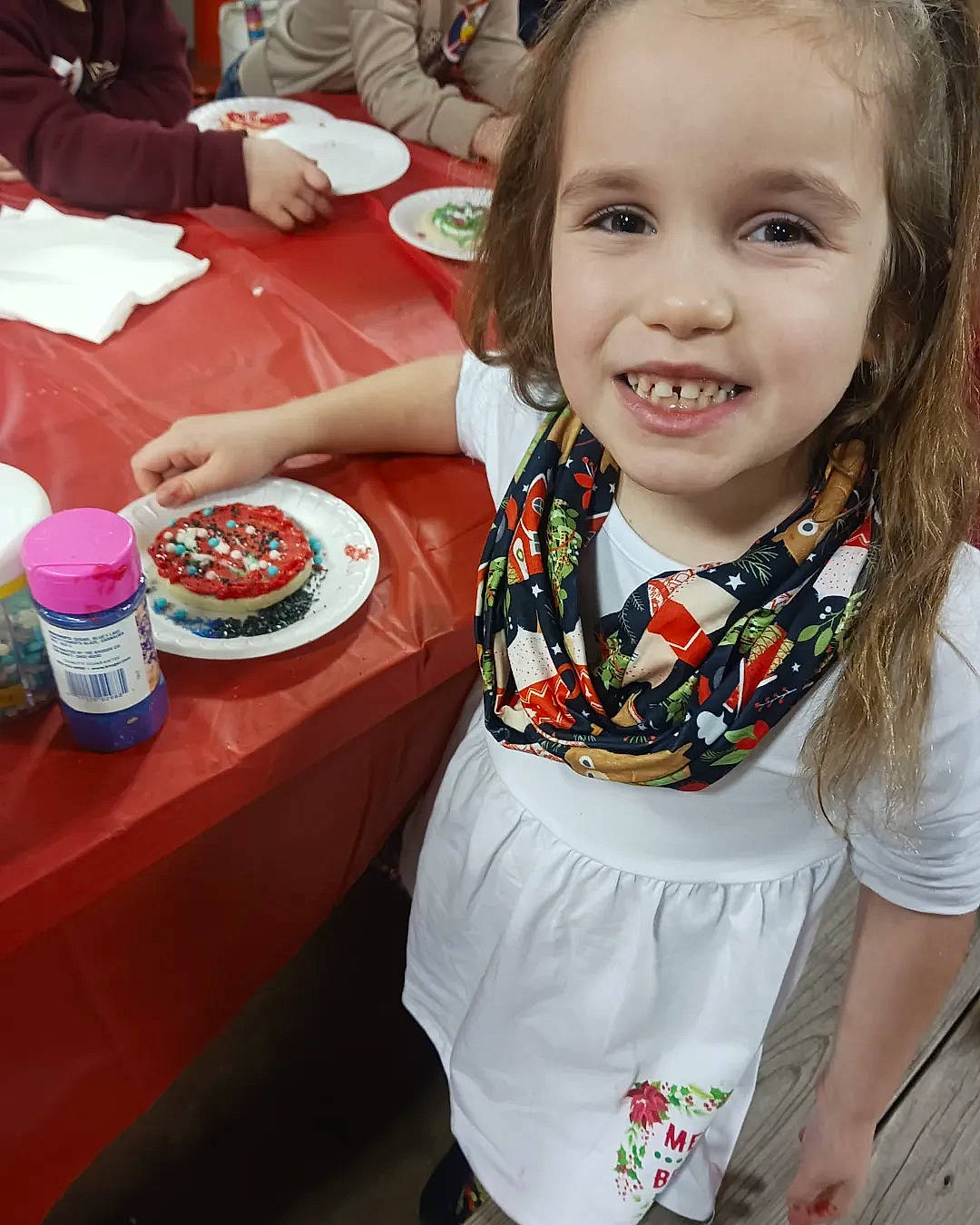Madalynn joined the competition — help win amazing prizes! baking, chair, child, comfort_food, cuisine, dessert, dish, event, food, fun, happy, joy, leisure, person, plate, sleeve, smile, sweetness, t_shirt, table