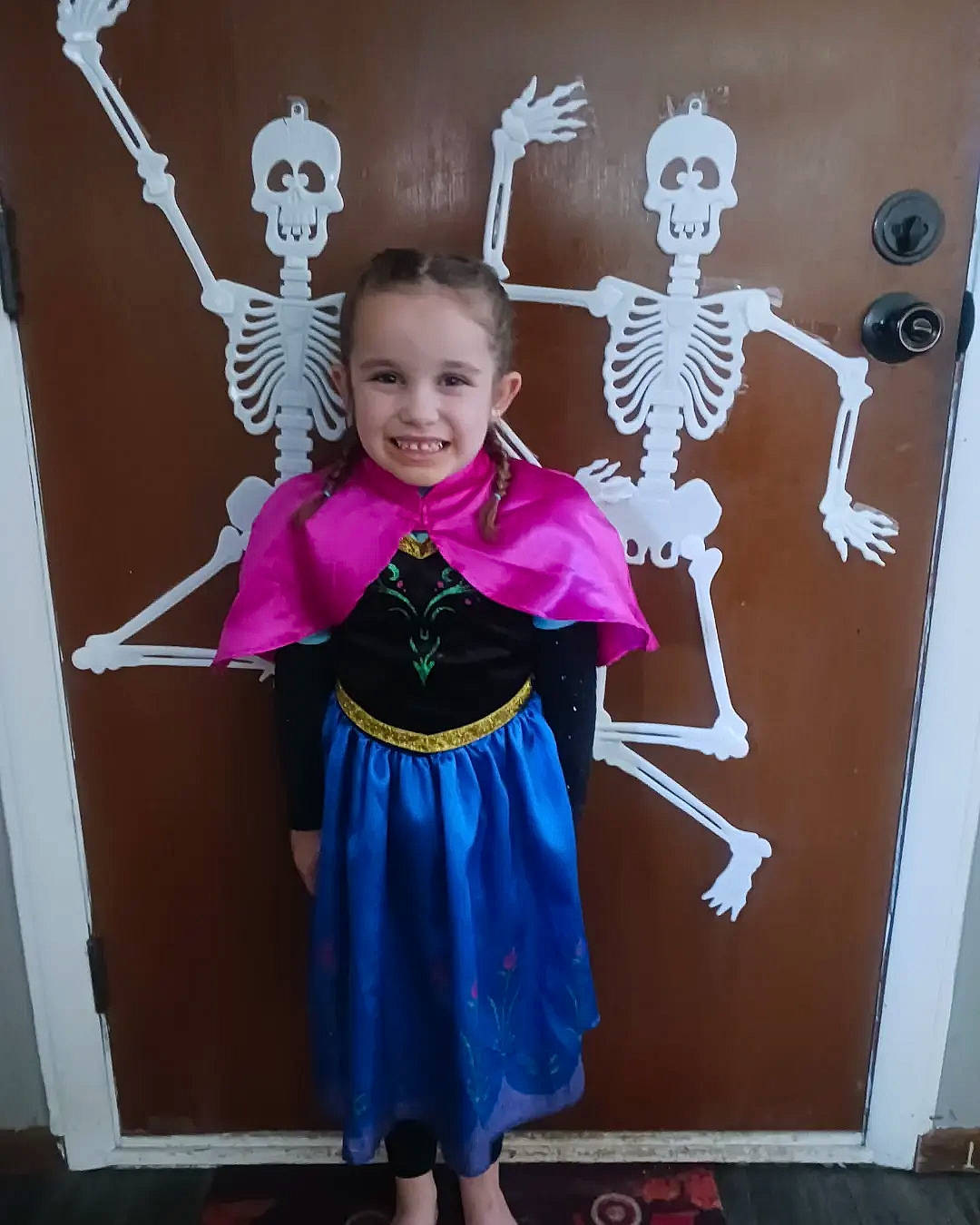 Madalynn is registered to the contest to win money with this photo: art, black, bone, child, child_art, costume, event, fashion_design, fun, gesture, happy, joy, magenta, person, pink, purple, room, skeleton, smile, toddler