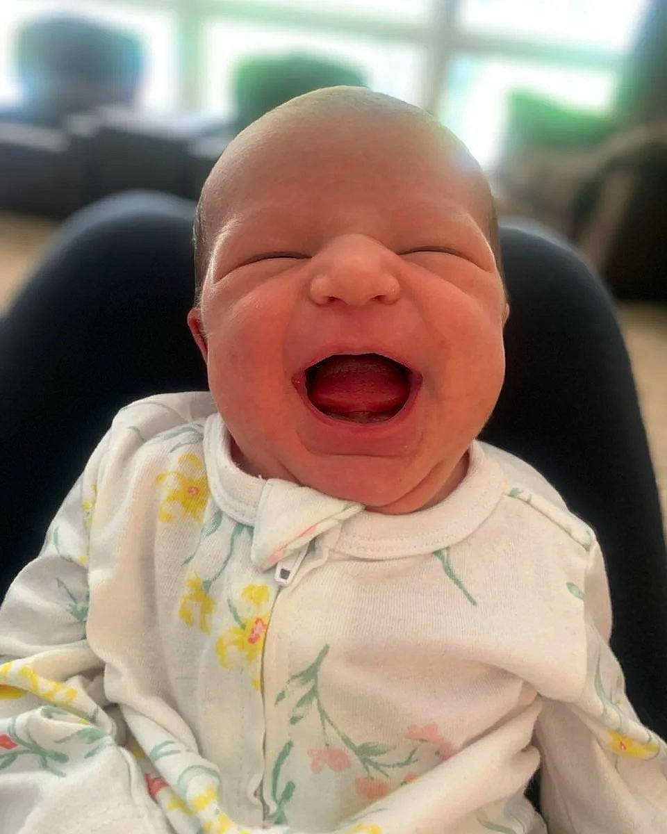 Cora is registered to the contest to win money with this photo: baby, baby_laughing, baby_toddler_clothing, cheek, chin, comfort, crying, face, fun, happy, head, laugh, lip, mouth, nose, person, shout, sleeve, smile, toddler