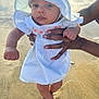 baby, child, infant, beach, sand, sunhat, dress, hands, feet, outdoor, sunlight, portrait, person, summer, cute, young_child, skin, blue_eyes, stripes, nature