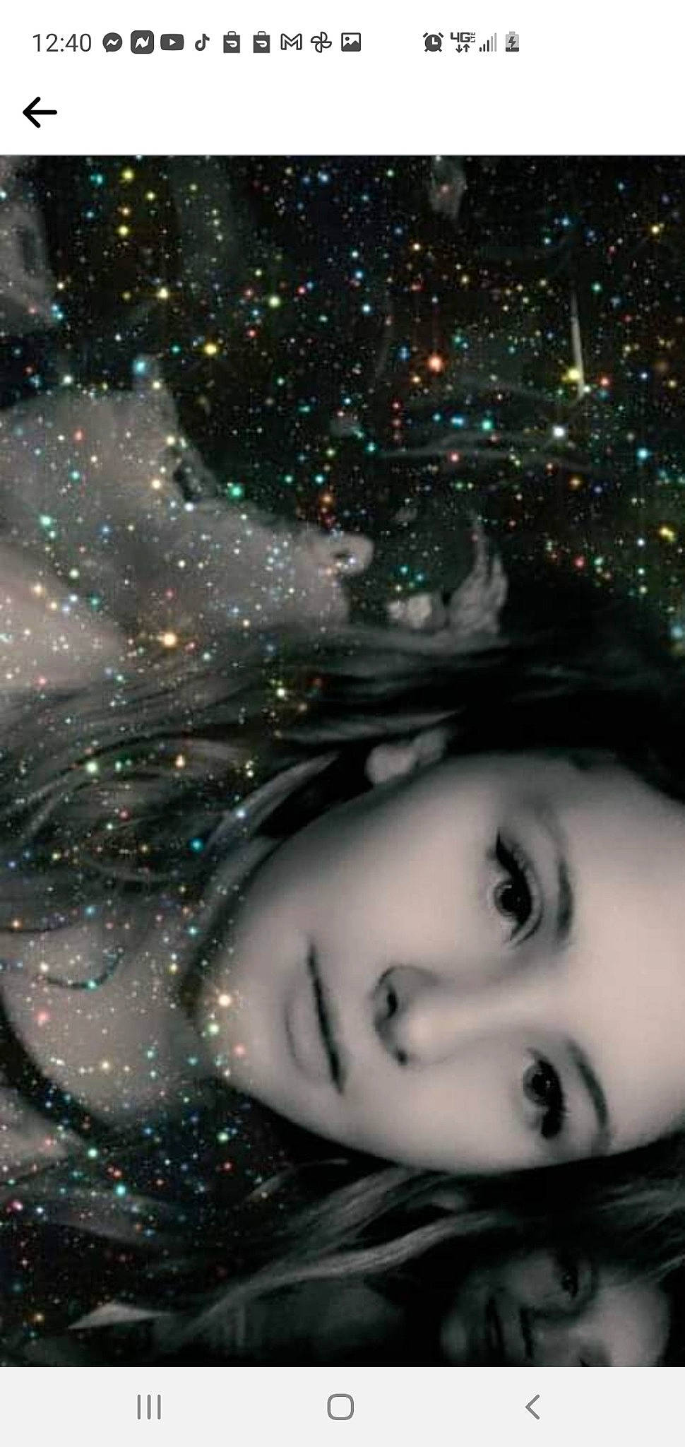 Zoe is registered to the contest to win money with this photo: christmas_ornament, eye, eyebrow, eyelash, facial_expression, flash_photography, hair, hairstyle, happy, head, human, iris, lip, mammal, nose, people_in_nature, person, photograph, sky, tree