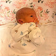 Echo joined the competition — help win amazing prizes! baby, bed, blanket, child, comfort, cozy, cute, face, floral_pattern, head, indoors, infant, lying_down, newborn, onesie, pacifier, peaceful, sleepwear, small, soft_lighting