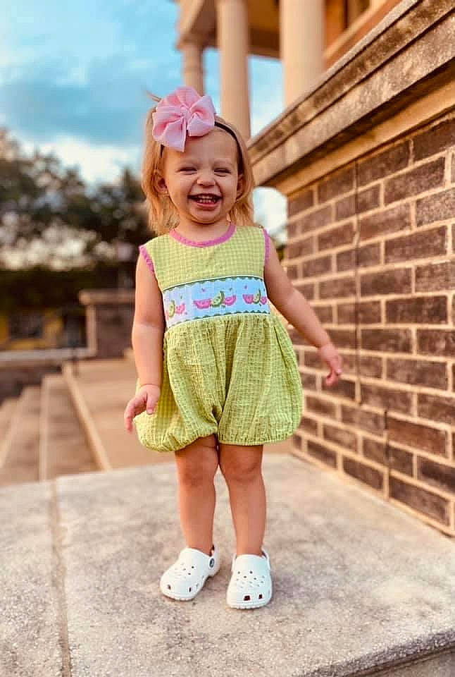 Brenley is registered to the contest to win money with this photo: baby_toddler_clothing, blond, denim, electric_blue, footwear, fun, hair, happy, headwear, human_leg, joy, leisure, magenta, person, pink, recreation, sky, sleeve, smile, street_fashion