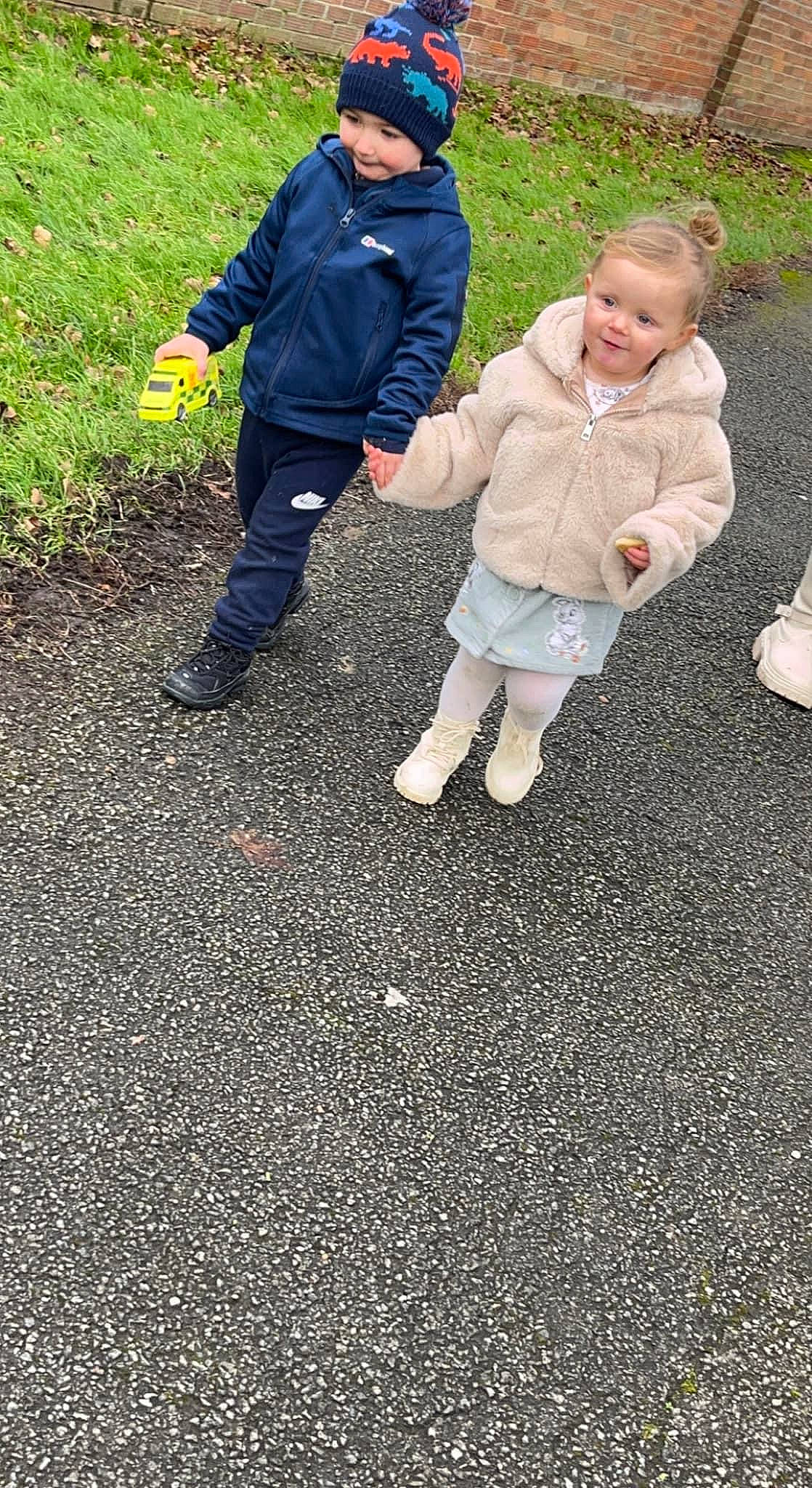 Harper-leigh is registered to the contest to win money with this photo: asphalt, baby, baby_toddler_clothing, boot, child, fun, gesture, grass, headwear, landscape, leisure, people_in_nature, person, recreation, road_surface, shadow, sidewalk, smile, soil, toddler