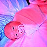 baby, pacifier, blanket, bed, infant, sleeping, soft_texture, wrapped, closeup, face, cute, child, comfort, indoors, portrait, resting, pink_light, blue_light, newborn, peaceful