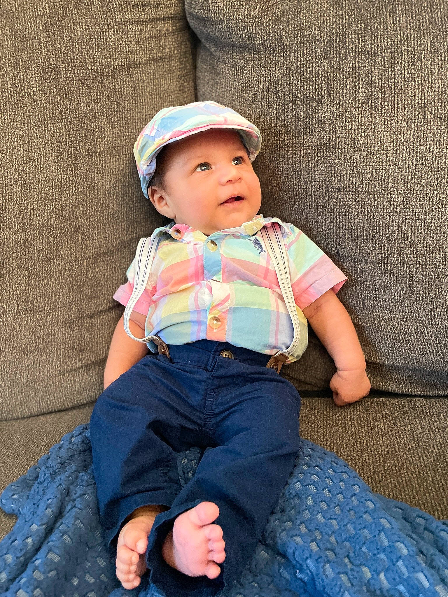 Liam joined the competition — help win amazing prizes! baby, baby_toddler_clothing, cap, cheek, child, chin, electric_blue, eye, flash_photography, fun, grass, happy, head, headwear, leisure, pattern, person, sitting, skin, sleeve
