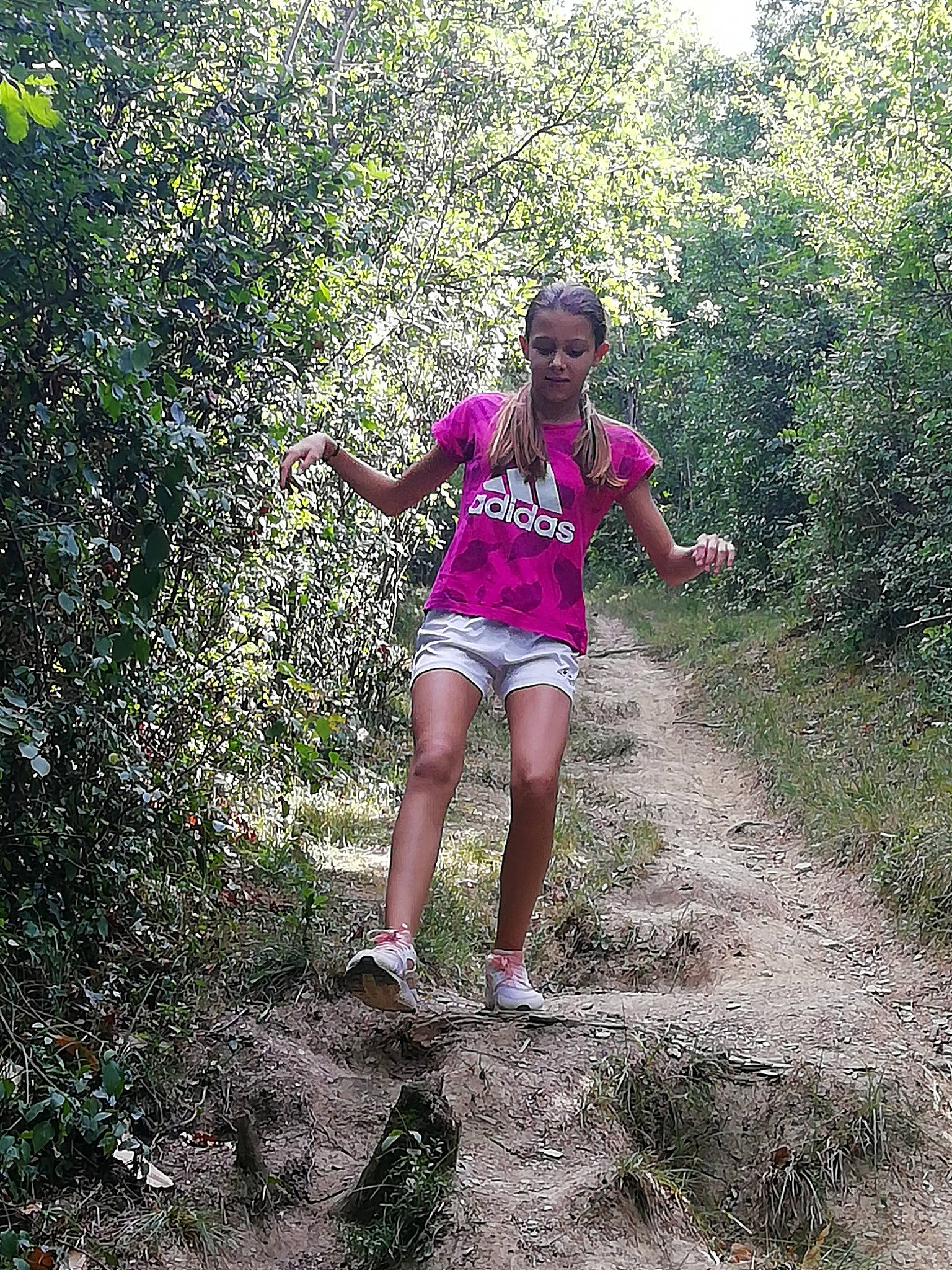 Luna participe au concours pour gagner de l'argent avec cette photo : adventure, forest, fun, grass, green, happy, jungle, leg, leisure, person, pink, plant, plant_community, recreation, shrub, soil, spring, summer, trail, tree