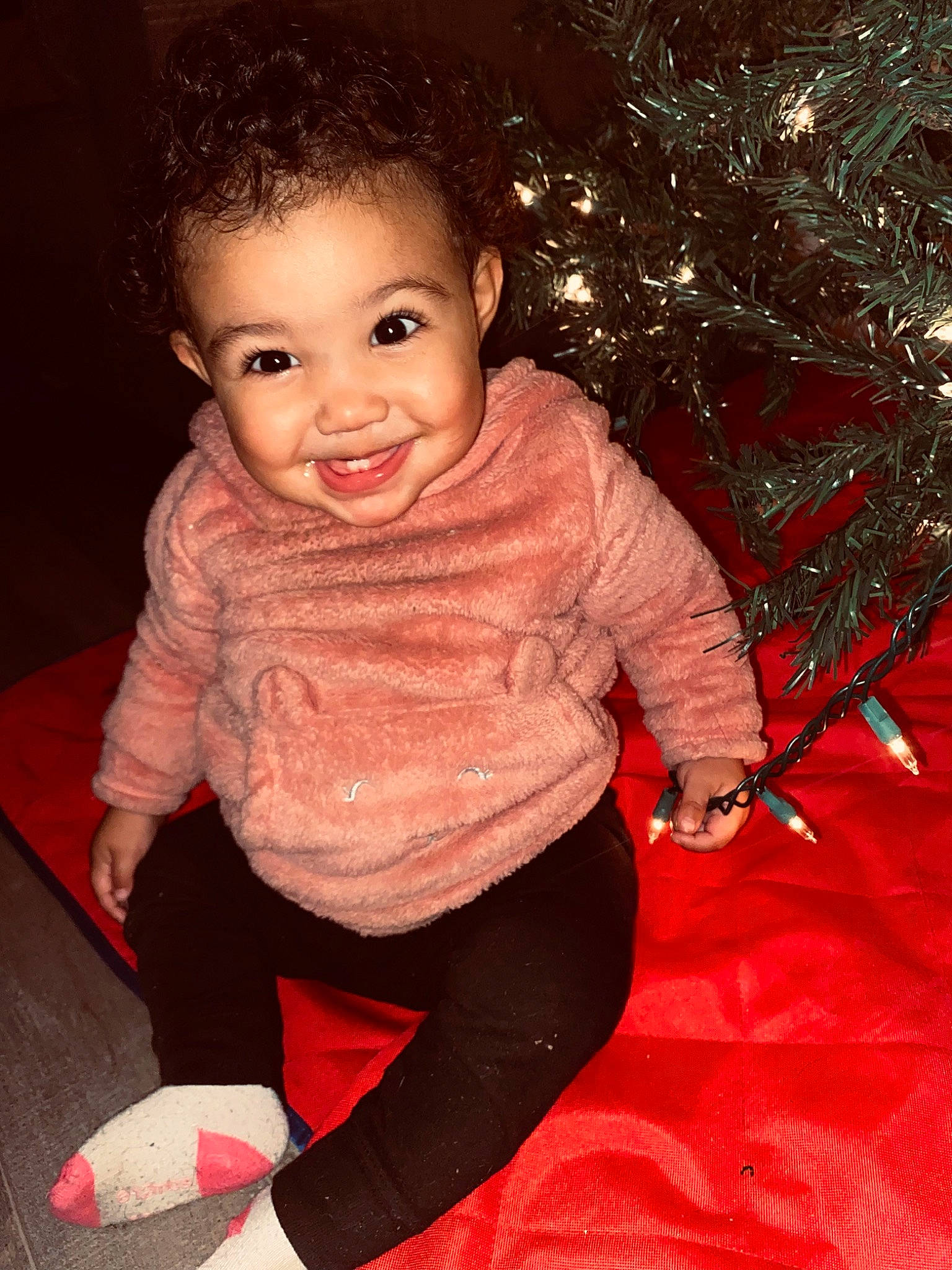 Ameliana joined the competition — help win amazing prizes! baby_toddler_clothing, cheek, chin, christmas_tree, eye, face, facial_expression, flash_photography, flooring, fun, happy, head, human_body, iris, joy, lip, nose, person, sleeve, smile