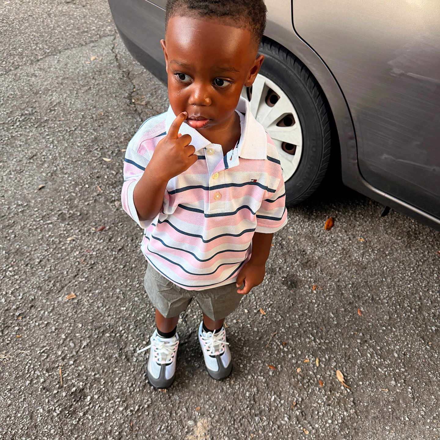 Saint joined the competition — help win amazing prizes! child, toddler, boy, portrait, standing, curious, thoughtful, finger, lip, striped_shirt, polo_shirt, shorts, sneakers, parked_car, car_wheel, asphalt, outdoor, daylight, street, fashion