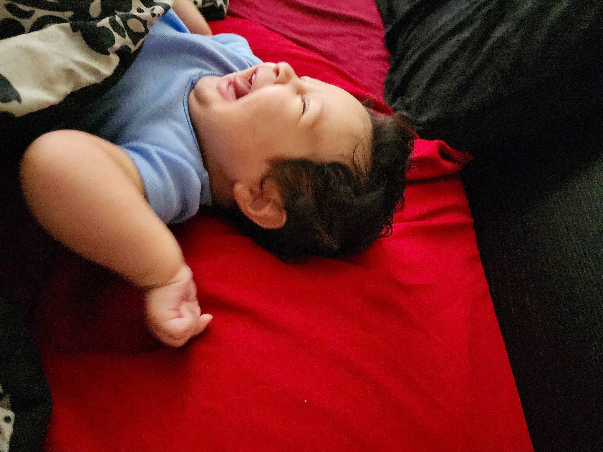 Natasha is registered to the contest to win money with this photo: abdomen, baby, bed, bedding, bedtime, chest, child, comfort, elbow, flash_photography, flooring, fun, human_leg, knee, linens, person, sitting, t_shirt, thigh, toddler