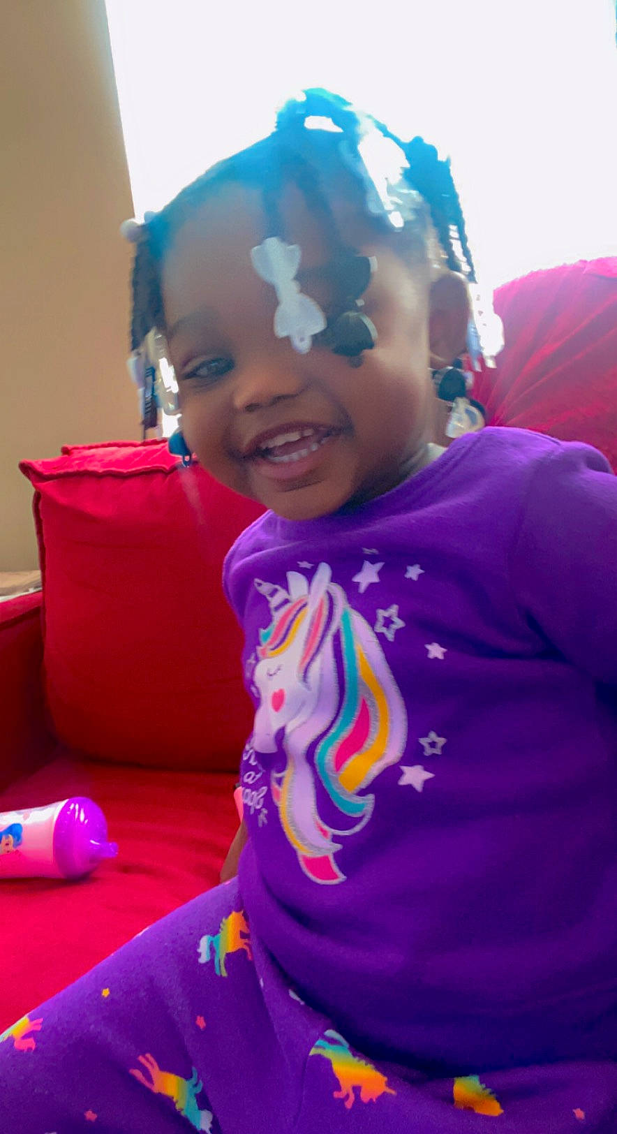 A'Mylah is registered to the contest to win money with this photo: audio_equipment, baby, child, electric_blue, event, facial_expression, fashion_accessory, fun, happy, leisure, magenta, person, personal_protective_equipment, pink, play, purple, recreation, smile, t_shirt, toddler