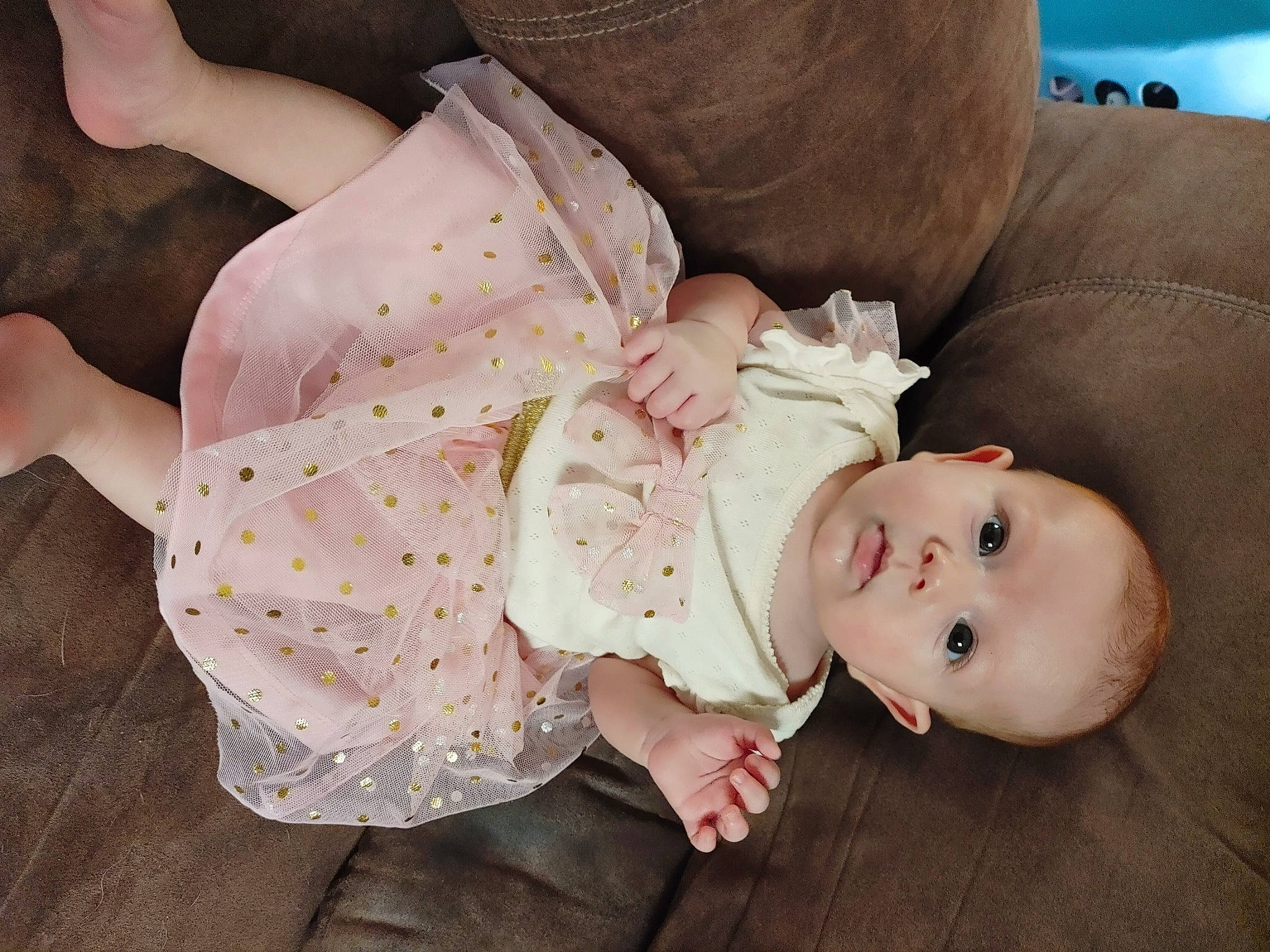 Vivien is registered to the contest to win money with this photo: arm, baby, baby_products, baby_toddler_clothing, cheek, child, comfort, dress, flash_photography, headgear, human_body, joint, person, pink, sitting, skin, sleeve, textile, toddler, toy