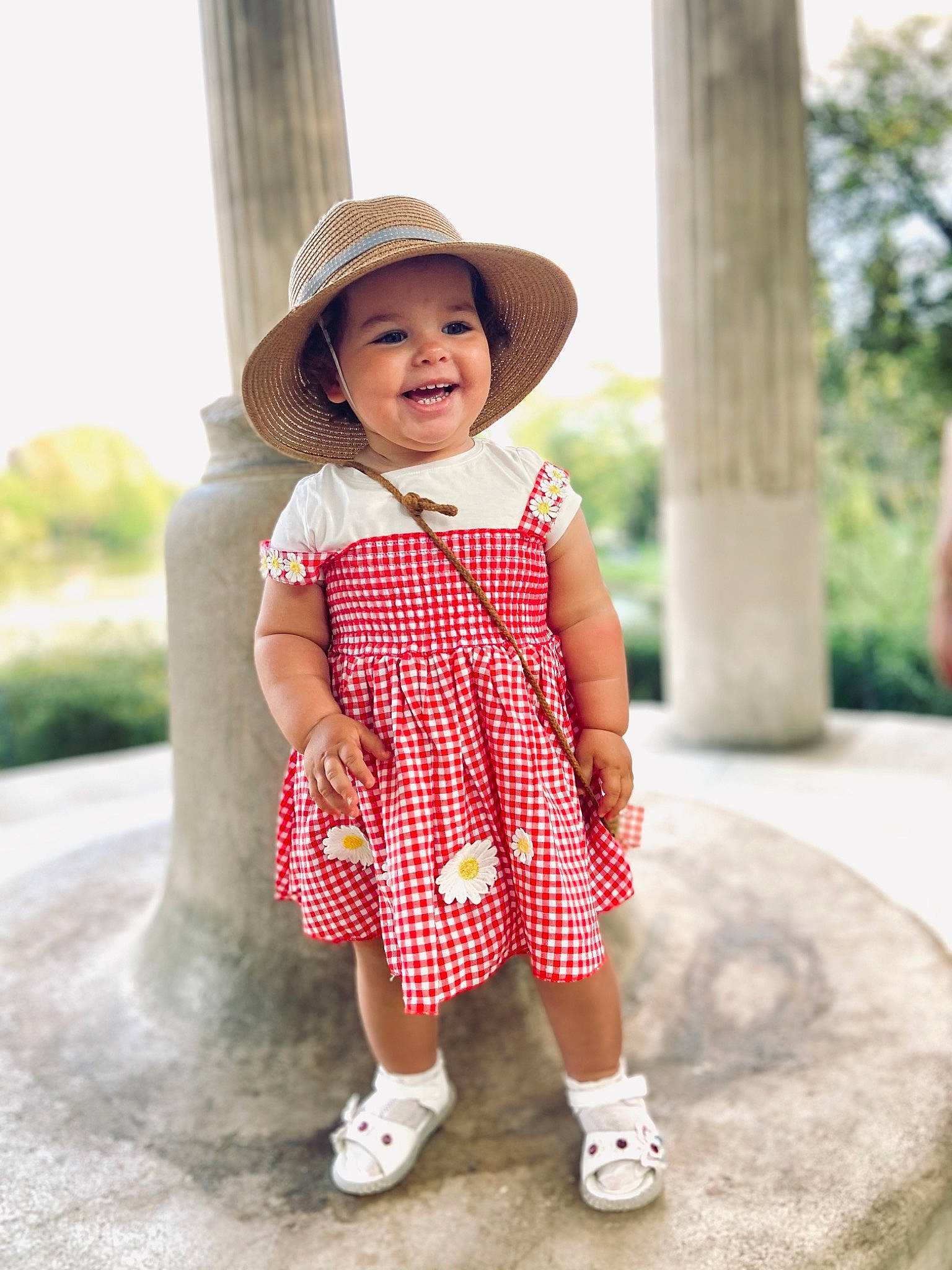 Amelia participe au concours pour gagner de l'argent avec cette photo : baby_toddler_clothing, dress, eye, face, footwear, happy, hat, headwear, joy, leaf, outerwear, person, pink, plaid, plant, shoulder, sleeve, smile, street_fashion, sun_hat