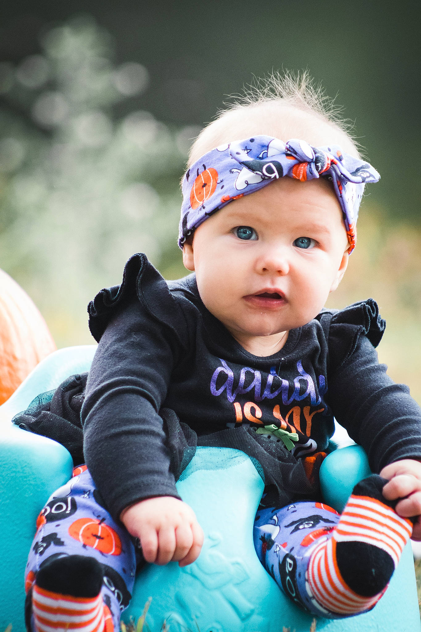 Avyanna is registered to the contest to win money with this photo: baby, baby_toddler_clothing, cap, child, eye, face, flash_photography, fun, grass, happy, headwear, iris, leisure, people_in_nature, person, plant, recreation, sitting, skin, toddler