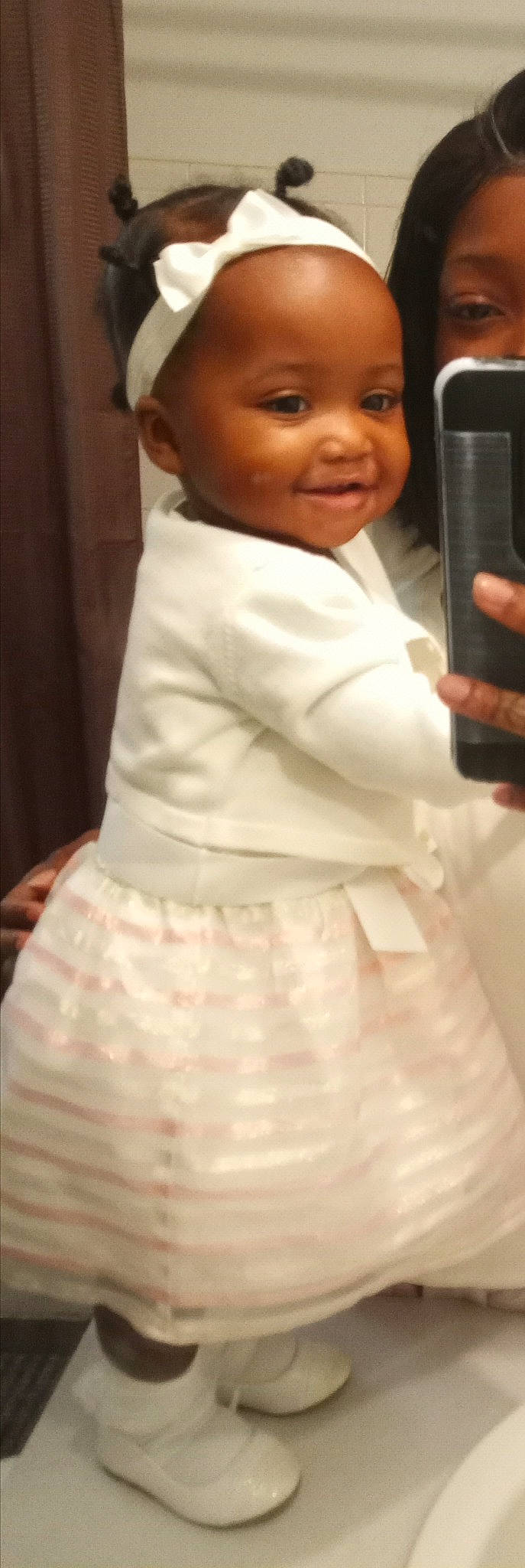 Cherish is registered to the contest to win money with this photo: baby, child, dress, formal_wear, gown, joy, person, skin, smile, toddler, white