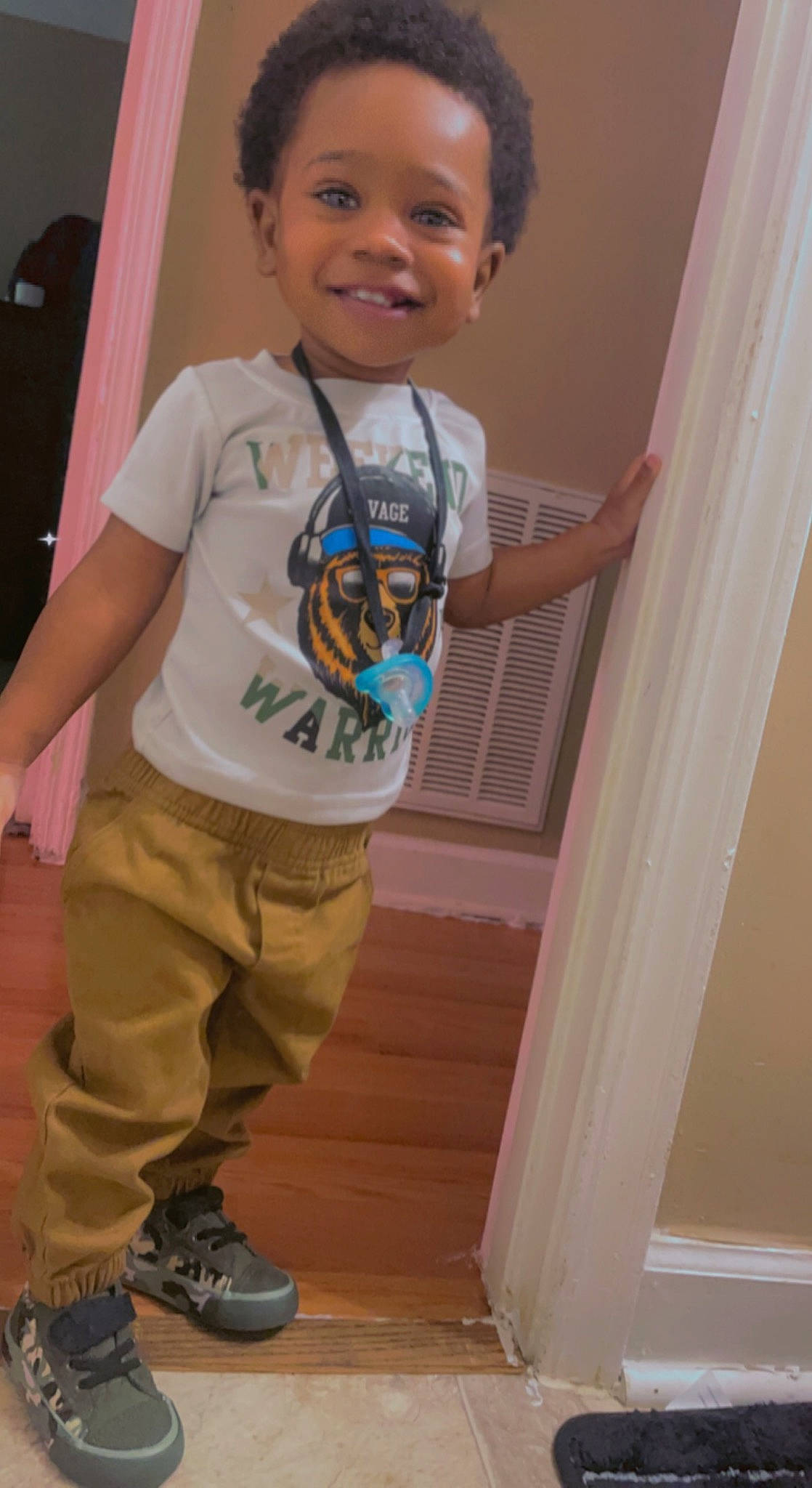 Quadir Sullivan is registered to the contest to win money with this photo: child, cool, elbow, fun, gesture, happy, hardwood, head, joint, joy, knee, leg, person, sleeve, smile, standing, t_shirt, thigh, toddler, trunk