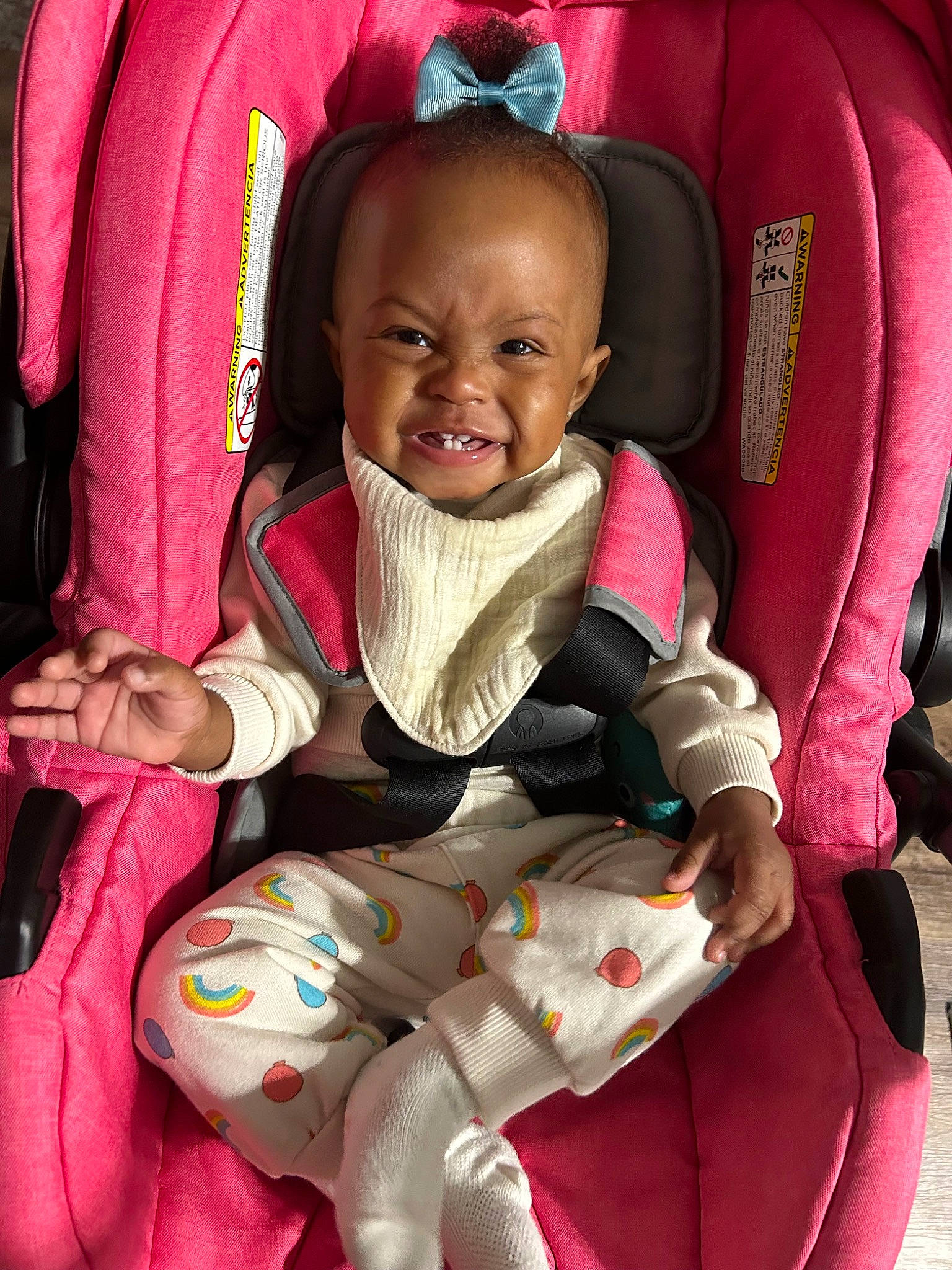 Eden is registered to the contest to win money with this photo: baby, baby_carriage, baby_in_car_seat, baby_safety, baby_toddler_clothing, car_seat, cheek, comfort, finger, happy, mouth, organ, person, pink, product, seat_belt, skin, smile, textile, toddler