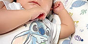 Jesse is registered to the contest to win money with this photo: baby, bed, blanket, bodypart, clothing, couch, crib, cushion, face, finger, furniture, hand, head, homedecor, infantbed, newborn, person, photography, portrait, sleeping