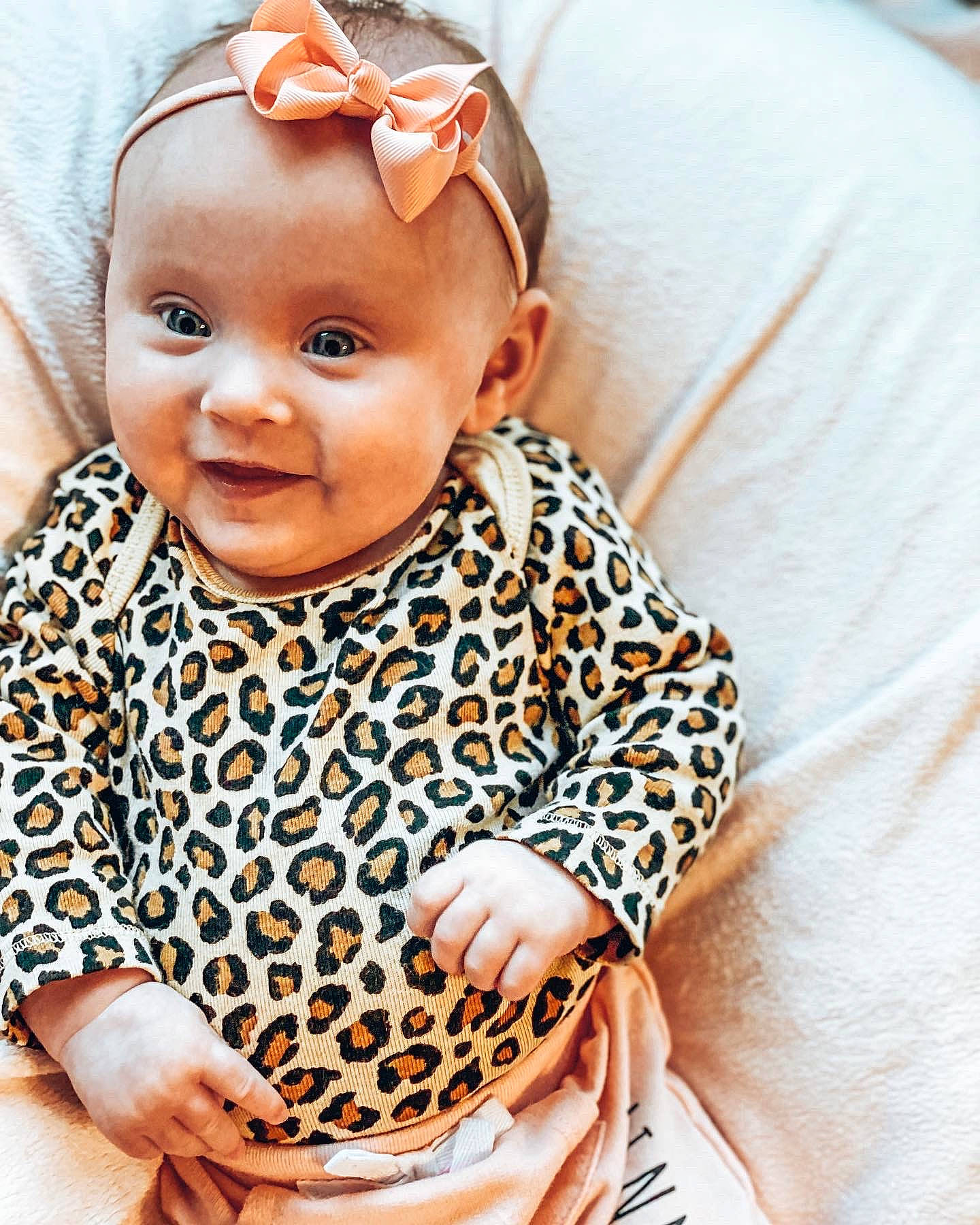 Annabella is registered to the contest to win money with this photo: baby, baby_toddler_clothing, child, eye, hair_accessory, happy, head, headband, headpiece, iris, jewellery, neck, necklace, outerwear, pattern, person, skin, sleeve, smile, textile