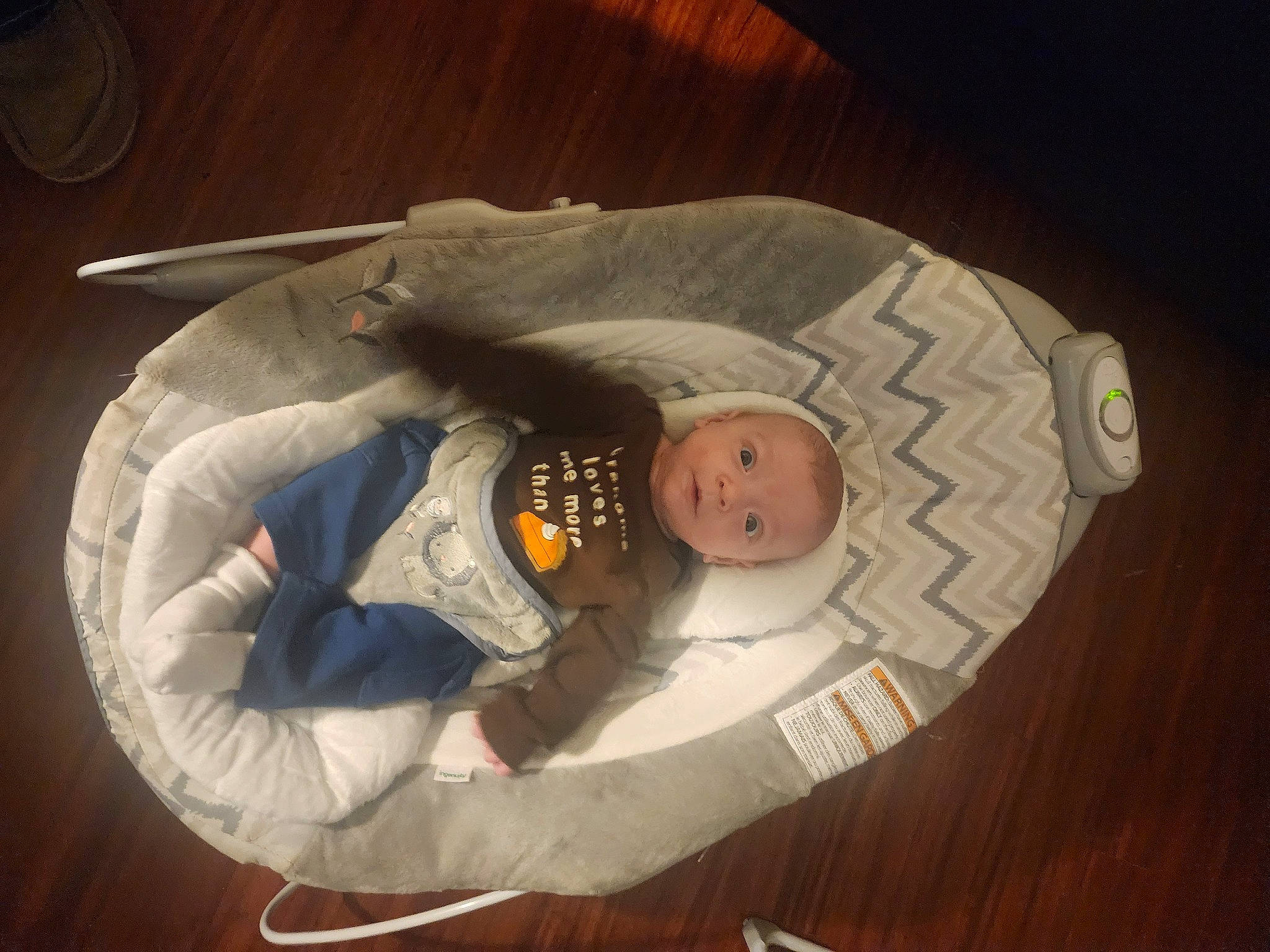 Jayce joined the competition — help win amazing prizes! astronaut, baby, baby_products, baby_toddler_clothing, baby_toys, carmine, circle, comfort, eye, fashion_accessory, flooring, hardwood, hat, person, personal_protective_equipment, sitting, toddler, wood