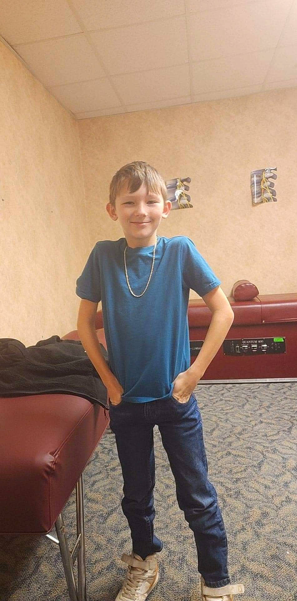 Joshua is registered to the contest to win money with this photo: child, chin, comfort, elbow, electric_blue, eyewear, flooring, fun, happy, joint, joy, knee, leisure, neck, person, shoulder, sleeve, smile, t_shirt, trunk