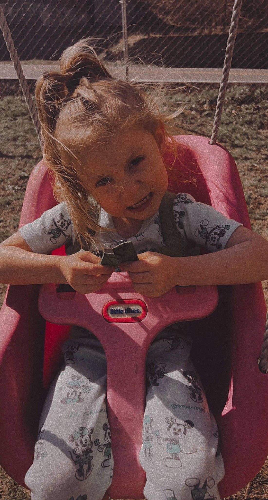 Nevaeh is registered to the contest to win money with this photo: baby_toddler_clothing, blond, eye, fun, grass, hair, hairstyle, happy, head, human_leg, leisure, lip, mouth, person, pink, recreation, sitting, skin, smile, thigh