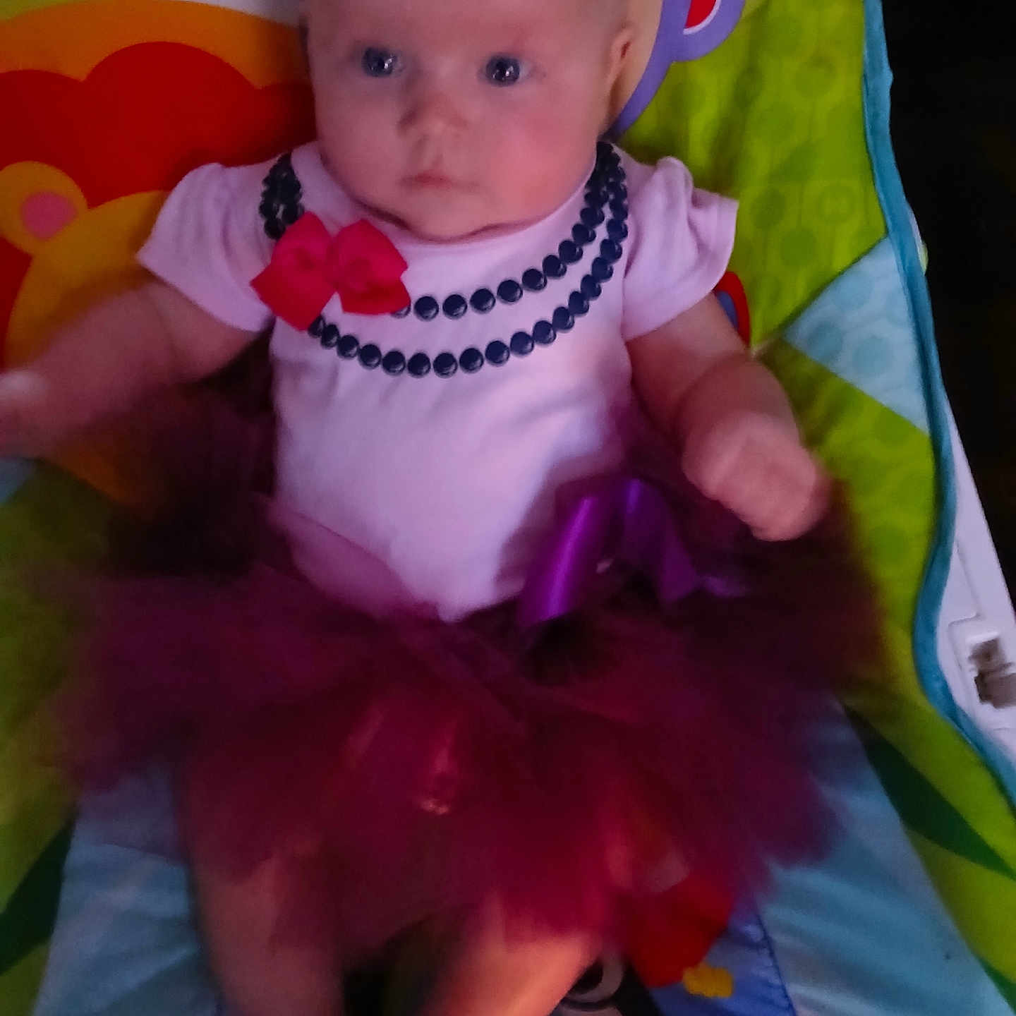 Eva is registered to the contest to win money with this photo: accessories, baby, bodypart, clothing, costume, cushion, dress, face, finger, hand, head, homedecor, jewelry, necklace, newborn, person, photography, portrait, purple, toy