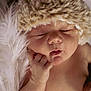 Ellianna joined the competition — help win amazing prizes! baby, sleeping, hat, fur, soft, peaceful, newborn, face, hand, skin, closeup, portrait, cute, infant, cozy, rest, child, adorable, warm, relaxation