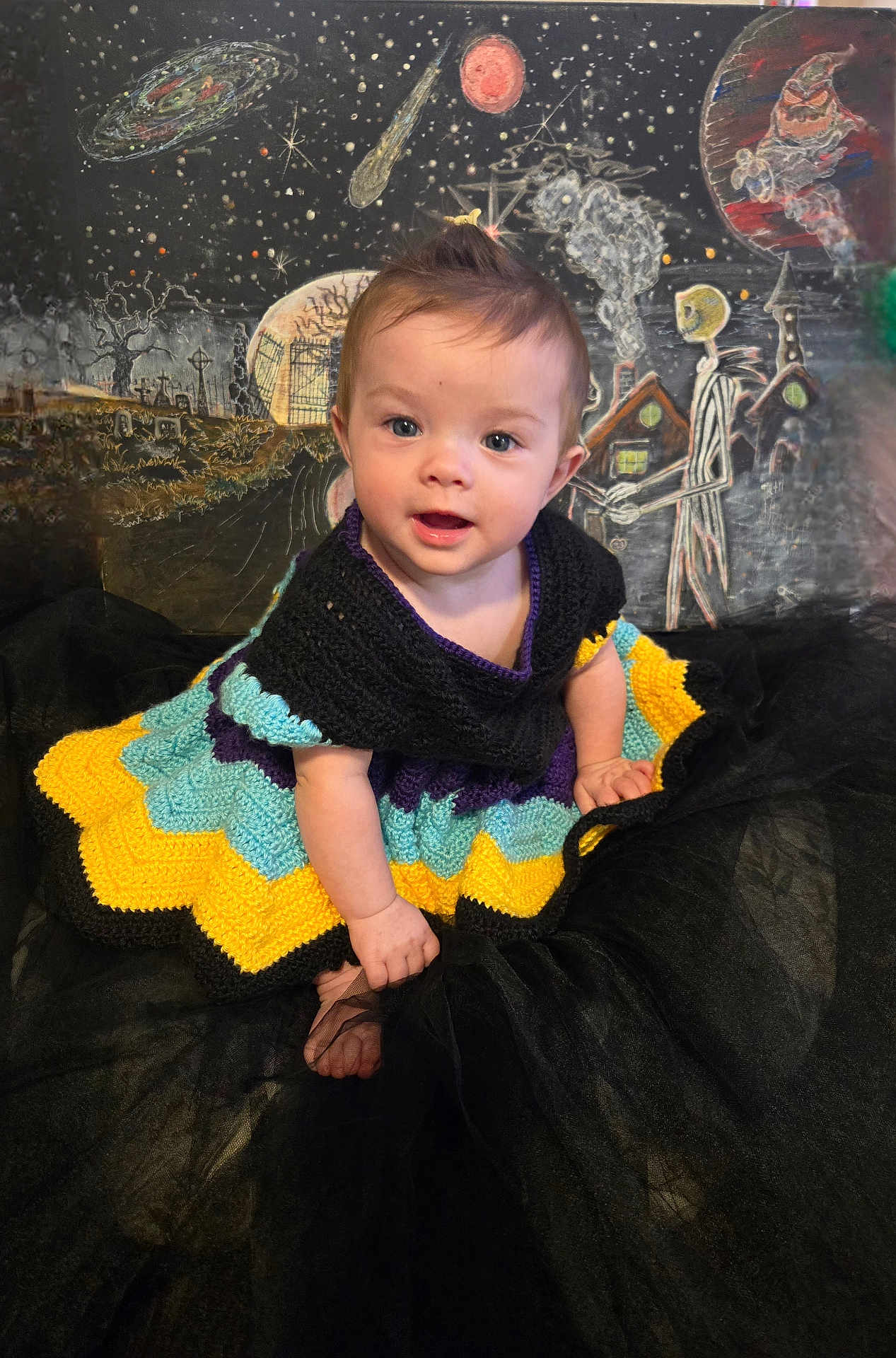 Odessa joined the competition — help win amazing prizes! baby, background_art, black_fabric, child, colorful_clothing, costume, crocheted_dress, cute, face, fantasy, ghost_figure, indoor, planets, portrait, seated, smiling, space_theme, stars, whimsical, young_child