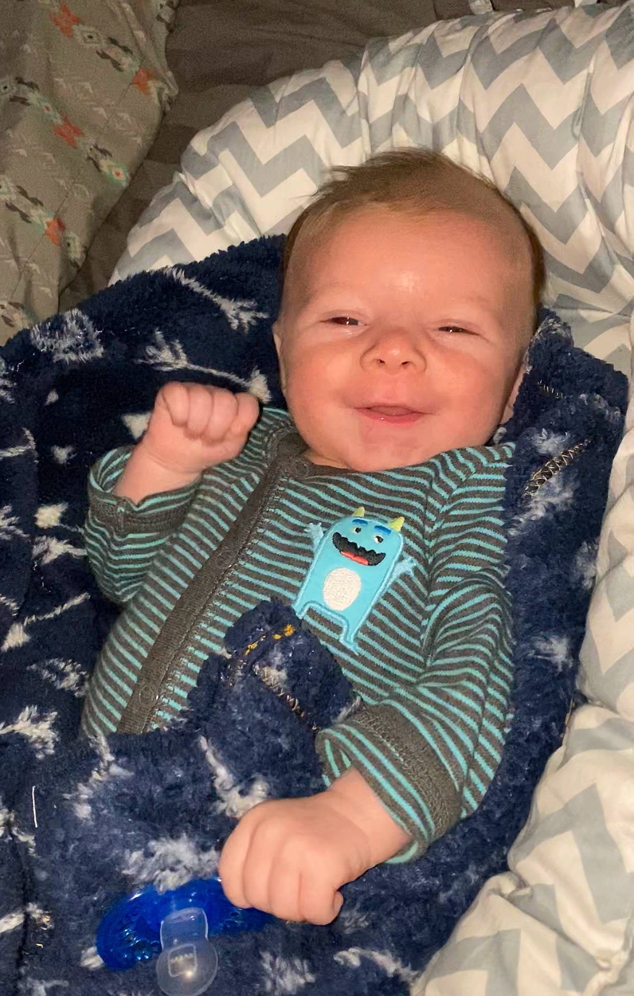 Cash is registered to the contest to win money with this photo: baby, baby_toddler_clothing, carnivore, child, comfort, companion_dog, dog, dog_breed, eye, fun, happy, mammal, outerwear, pattern, person, skin, sleeve, smile, textile, toddler