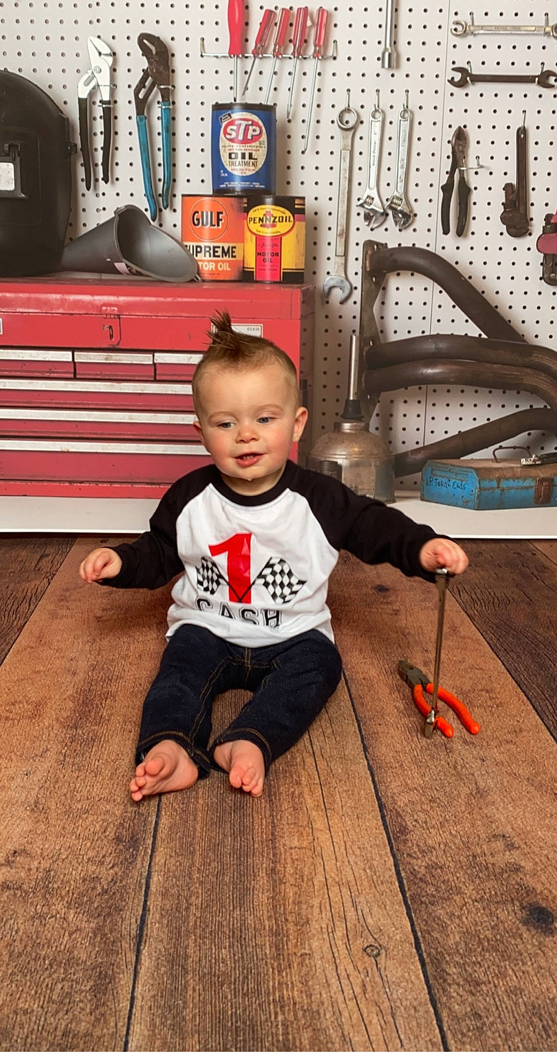 Cash joined the competition — help win amazing prizes! baby_toddler_clothing, child, deck, drawer, floor, flooring, fun, happy, hardwood, laminate_flooring, leisure, person, picture_frame, sitting, smile, t_shirt, toddler, varnish, wood, wood_flooring