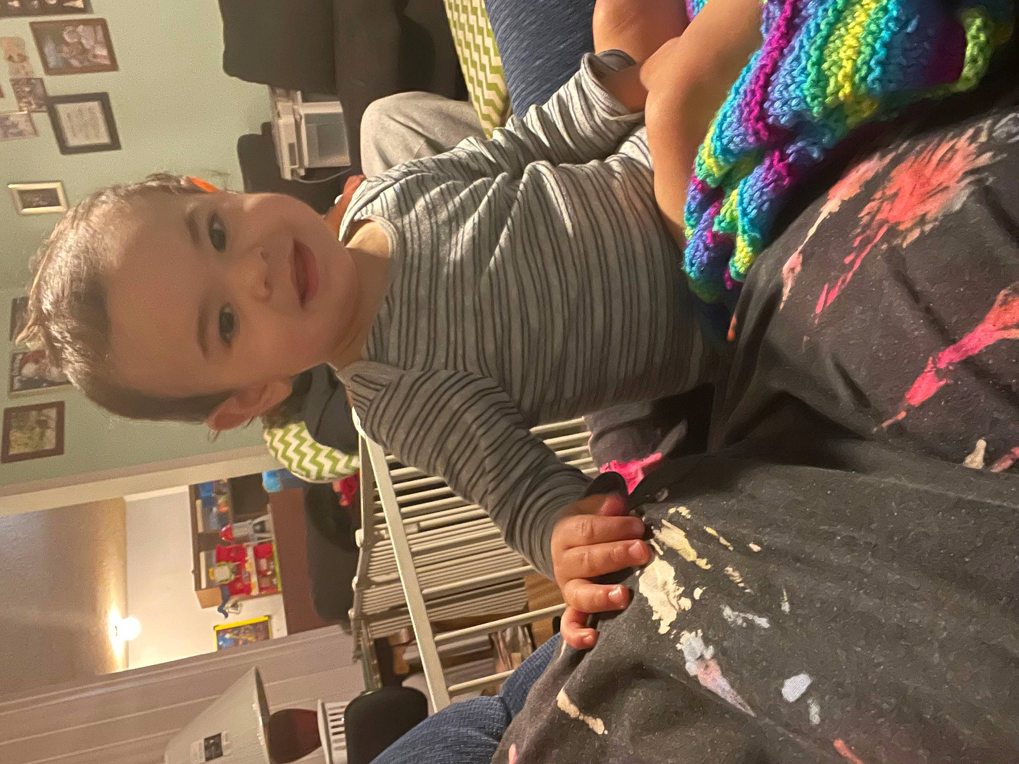 Marquez is registered to the contest to win money with this photo: audio_equipment, baby, child, event, eyewear, fun, gesture, hairstyle, hand, joy, nail, pattern, person, picture_frame, plaid, play, room, sitting, t_shirt, toddler