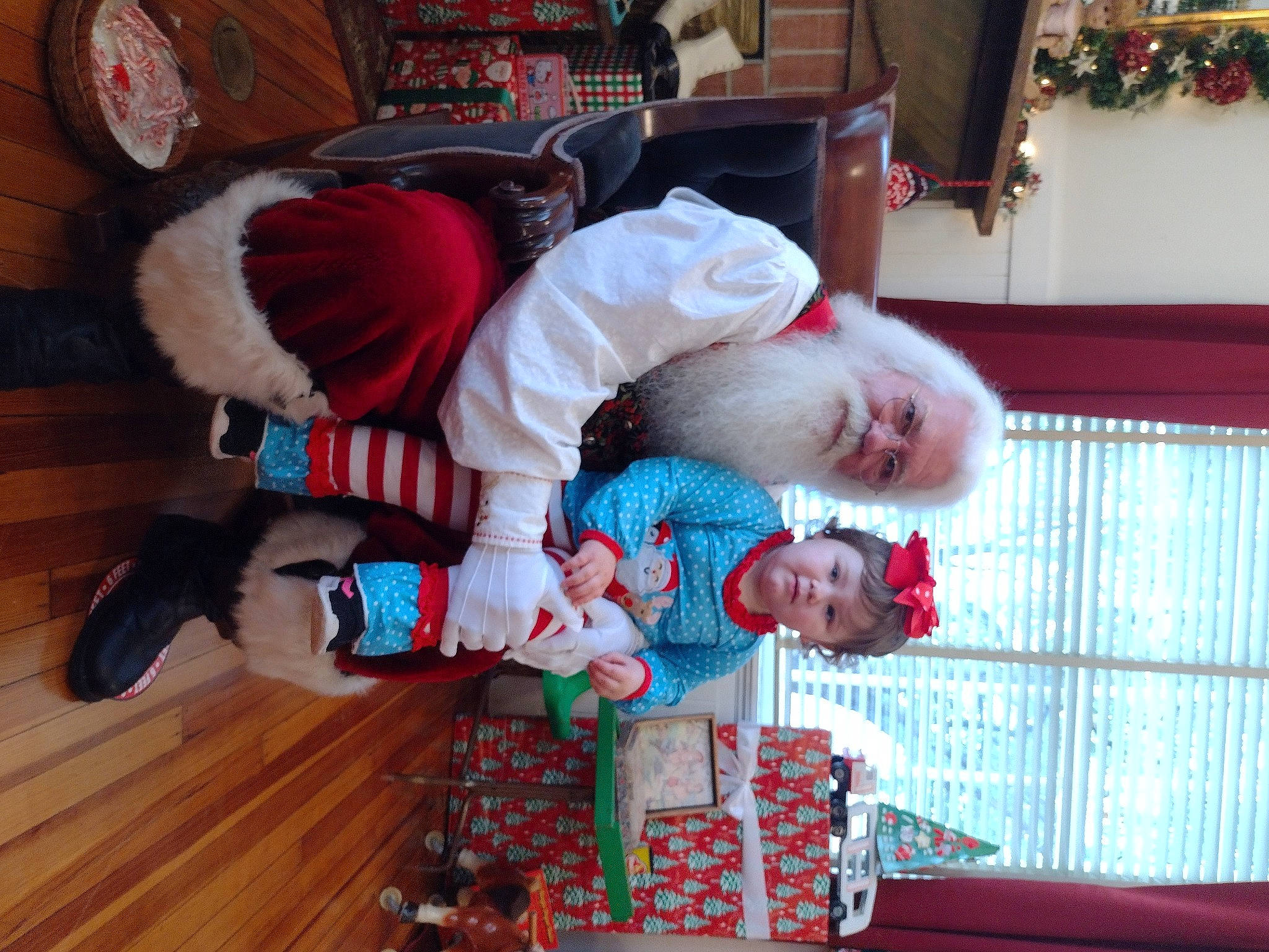 Amara joined the competition — help win amazing prizes! baby, baby_toddler_clothing, child, comfort, event, flooring, fun, hardwood, holiday, human_body, lap, leisure, person, picture_frame, plant, room, sitting, toddler, tree, winter