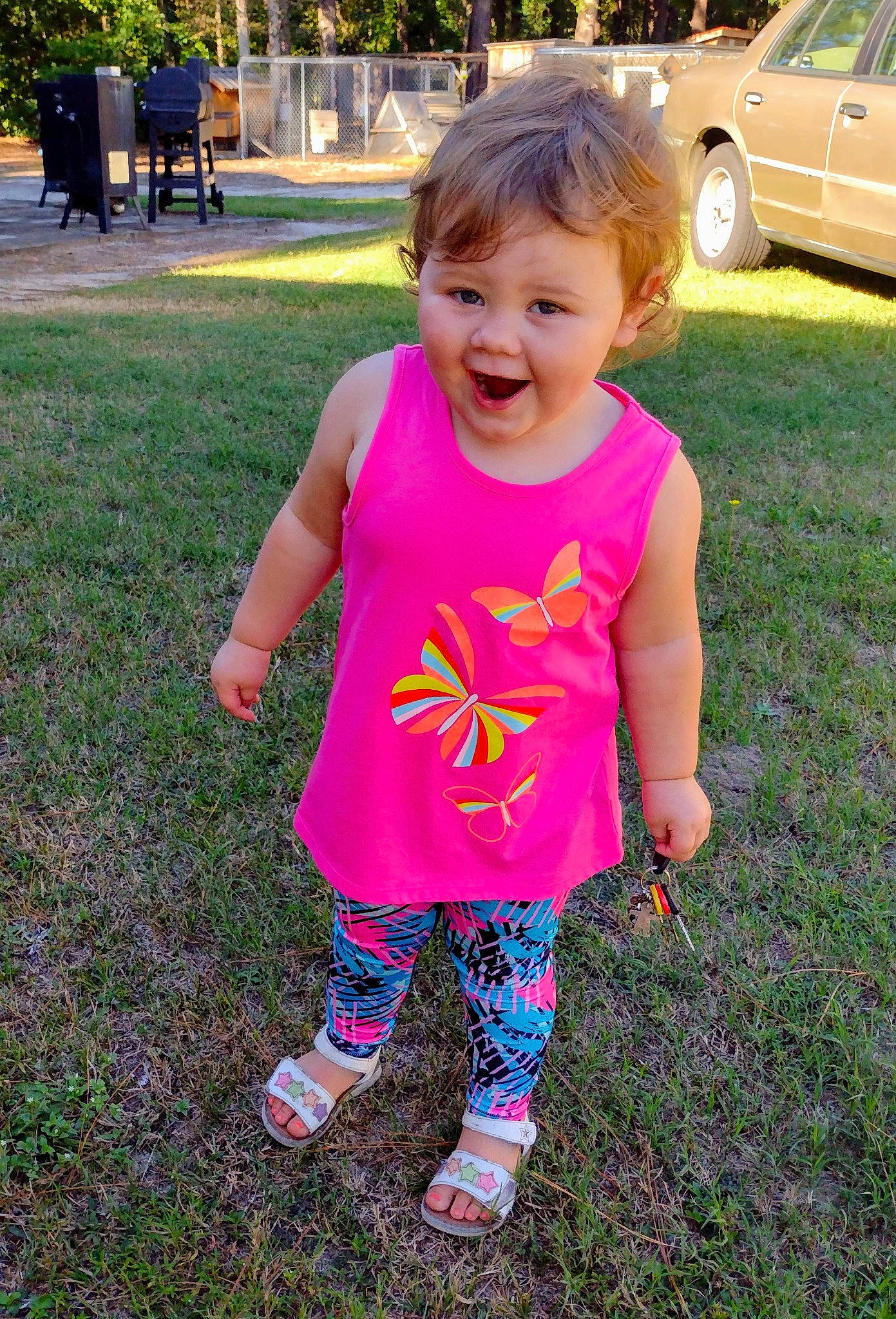 Amara is registered to the contest to win money with this photo: baby_toddler_clothing, cool, eye, grass, hand, happy, head, human_body, leisure, morning, people_in_nature, person, pink, plant, sleeve, smile, summer, t_shirt, tire, toddler