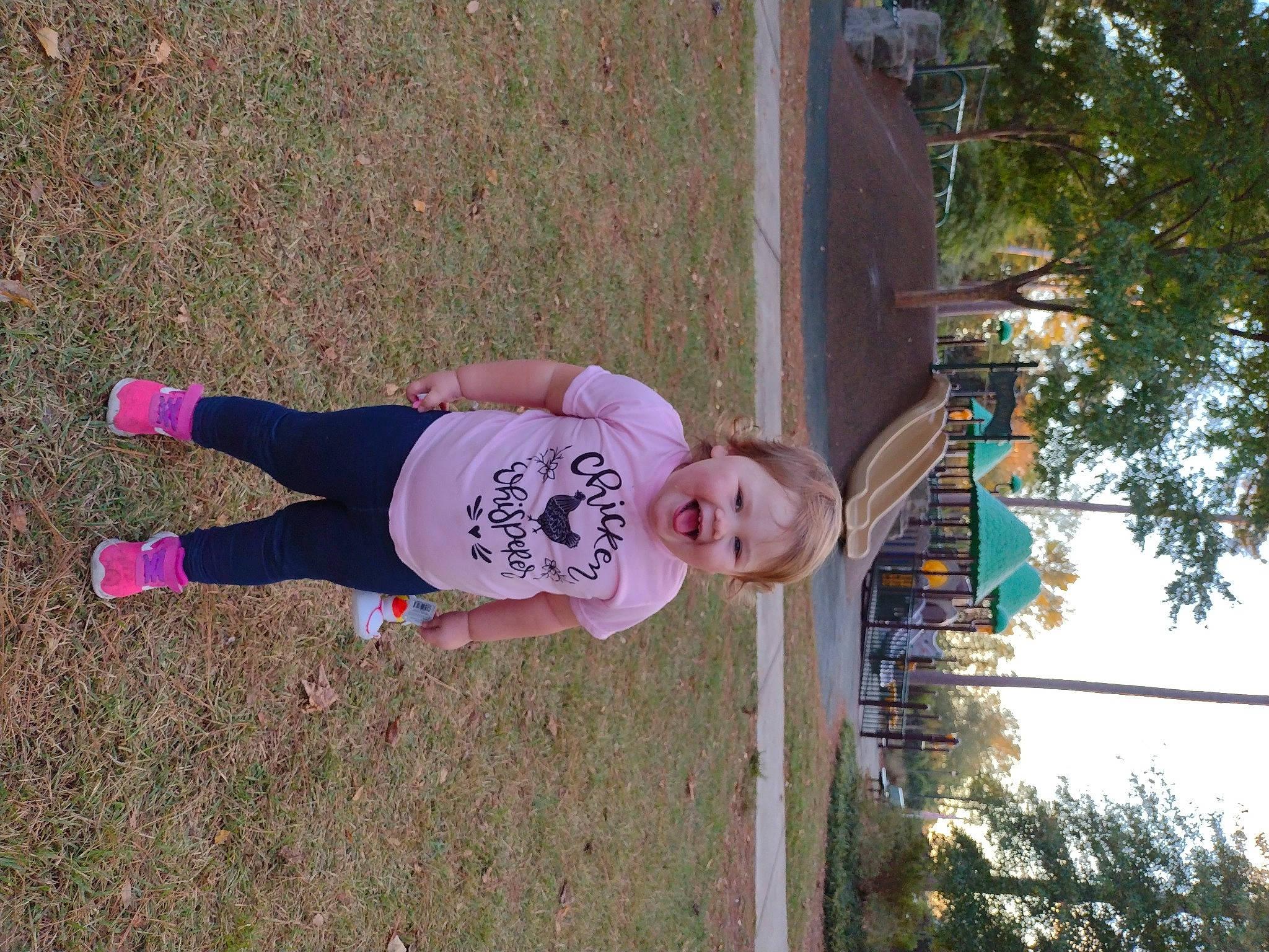 Amara is registered to the contest to win money with this photo: fun, grass, happy, leisure, magenta, people_in_nature, person, plant, pole, sky, smile, soil, t_shirt, toddler, tree, walking_shoe