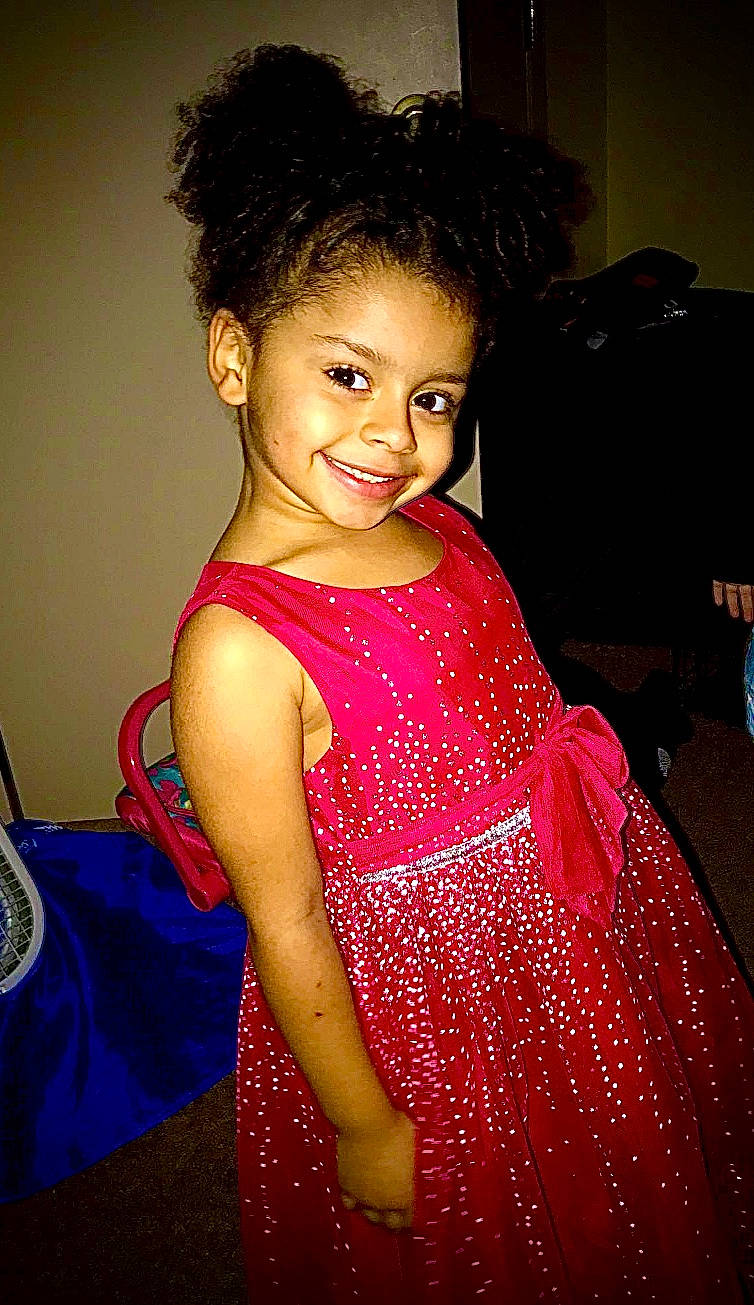 Liyah is registered to the contest to win money with this photo: black_hair, cheek, child, child_model, dress, fashion_design, formal_wear, fun, hair, joy, person, pink, smile, toddler