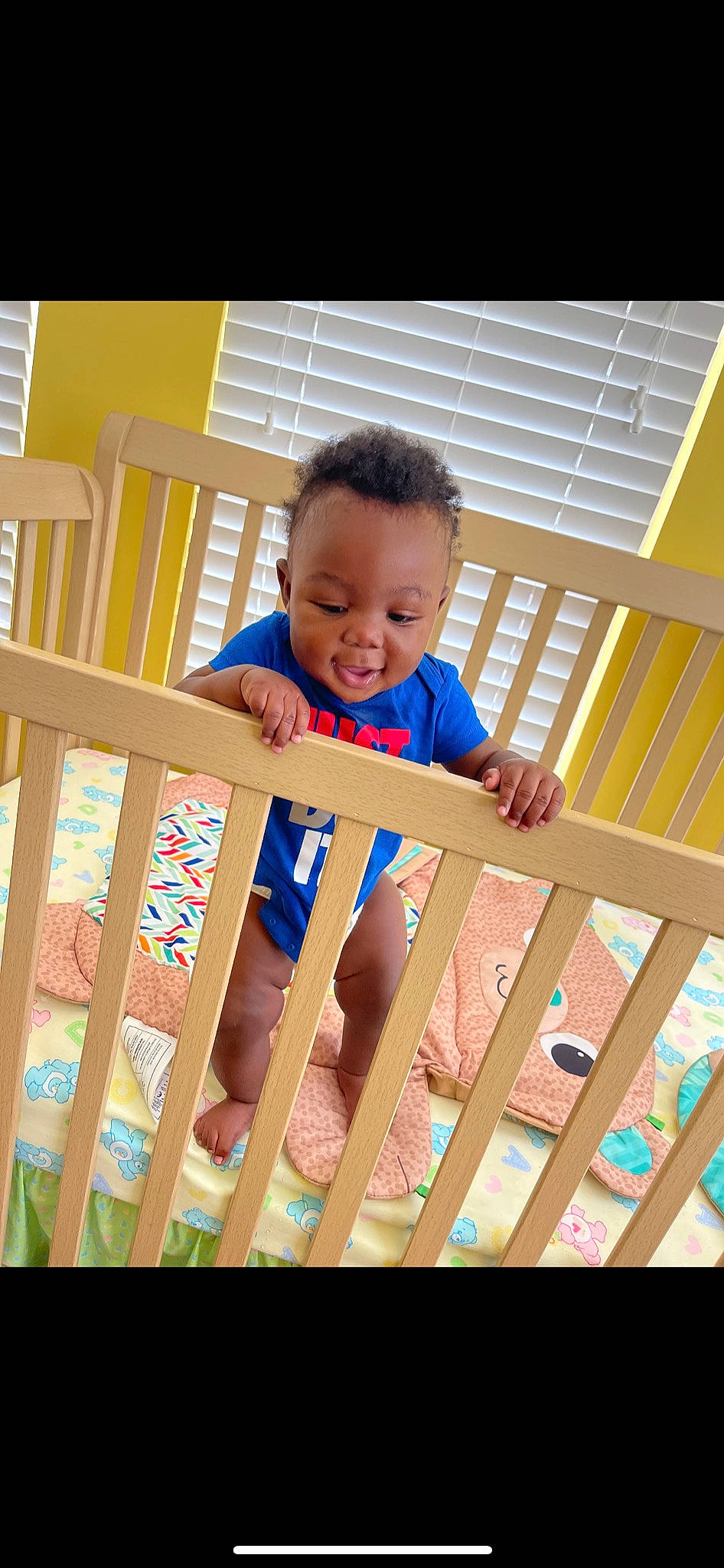 Taylin joined the competition — help win amazing prizes! baby, baby_safety, baby_toddler_clothing, clothing, cradle, eye, fence, hand, happy, human_body, leg, line, mammal, person, skin, sleeve, smile, t_shirt, toddler, wood