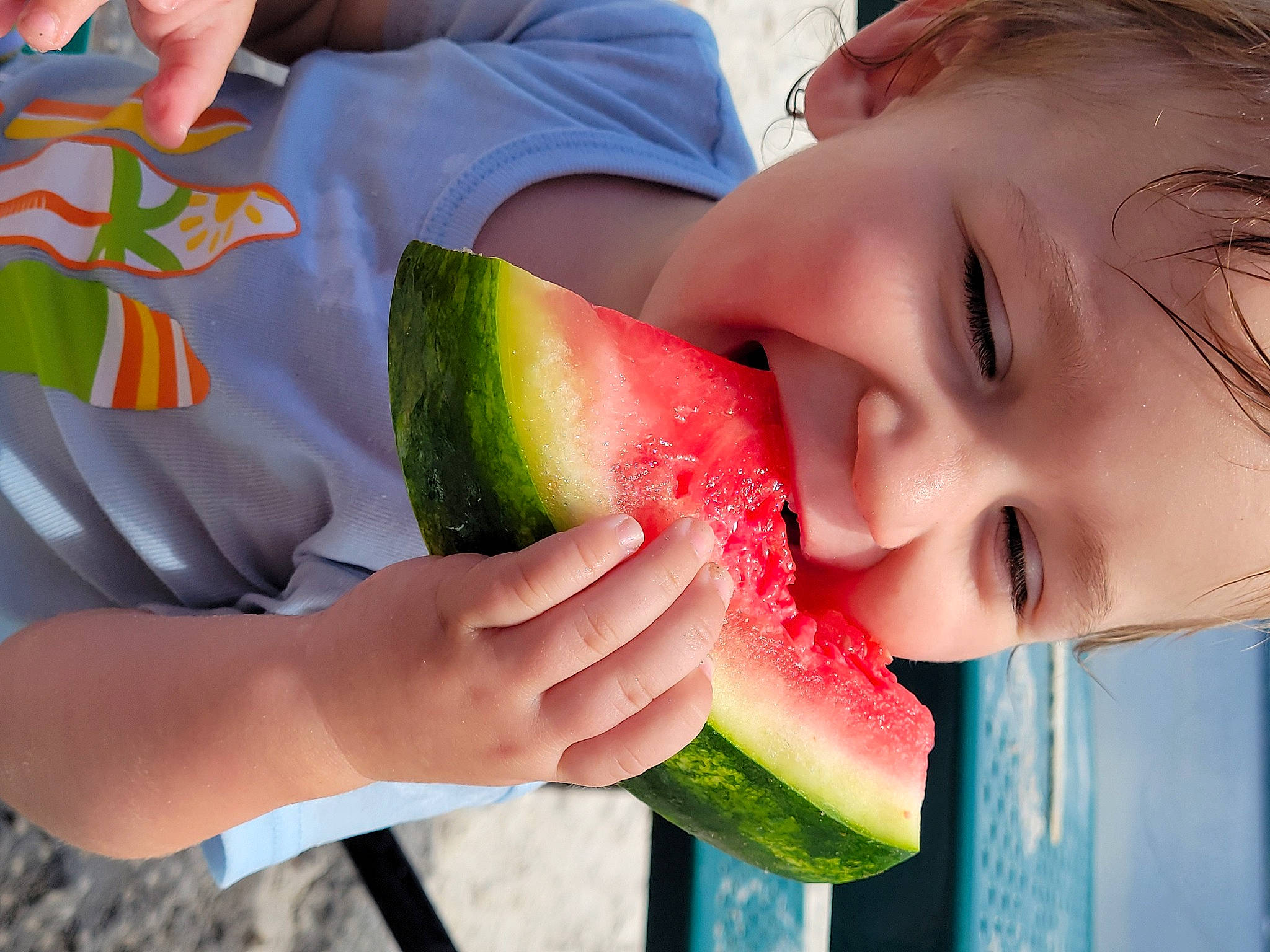 Cole joined the competition — help win amazing prizes! citrullus, facial_expression, finger, food, fruit, green, hand, happy, joy, melon, mouth, natural_foods, neck, person, photograph, plant, product, red, seedless_fruit, sharing
