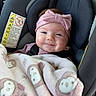 baby, car_seat, blanket, smile, headband, pink, child, infant, cute, happy, face, clothing, safety, seatbelt, indoor, person, portrait, soft, warm, monkey_pattern