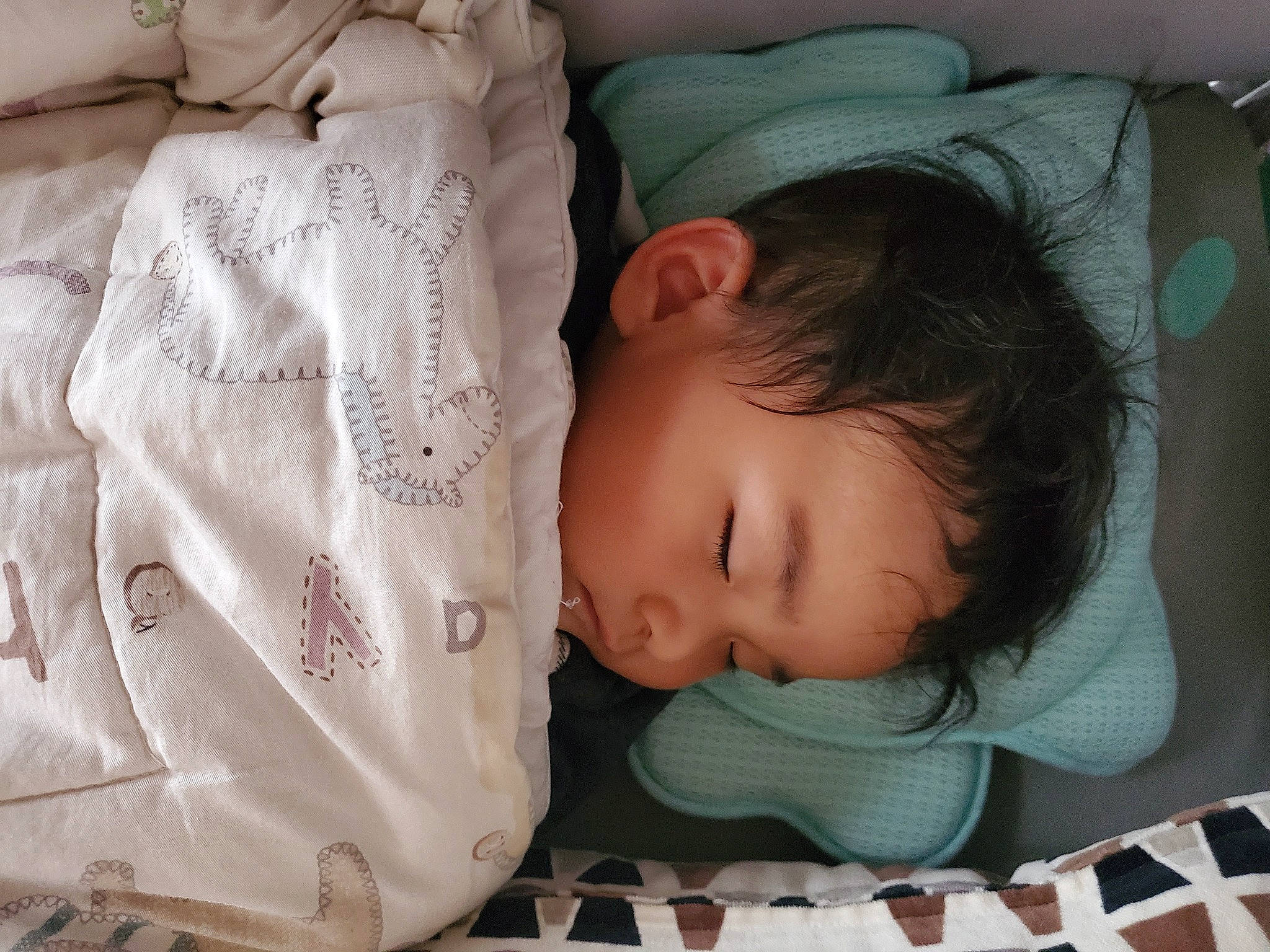 Zack is registered to the contest to win money with this photo: baby, baby_safety, baby_sleeping, baby_toddler_clothing, cheek, child, chin, comfort, eye, face, head, infant_bed, iris, linens, person, product, skin, sleeve, textile, toddler