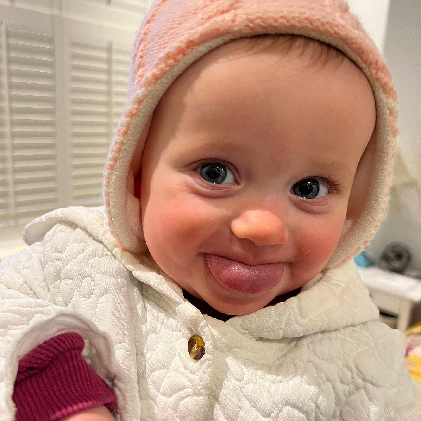 Bobby-Rose is registered to the contest to win money with this photo: baby, babylaughing, beanie, bodypart, bonnet, cap, clothing, coat, costume, door, face, finger, fleece, hand, happy, hardwood, hat, head, hood, hoodie