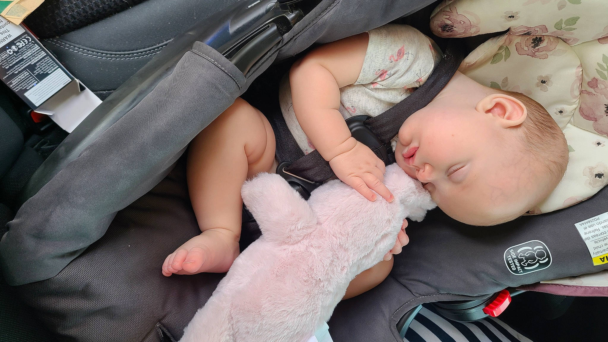 Charlotte is registered to the contest to win money with this photo: auto_part, baby, baby_toddler_clothing, car_seat, child, comfort, finger, gesture, hand, human_leg, joint, mammal, nail, person, personal_luxury_car, skin, thumb, toddler, vehicle_door, vertebrate