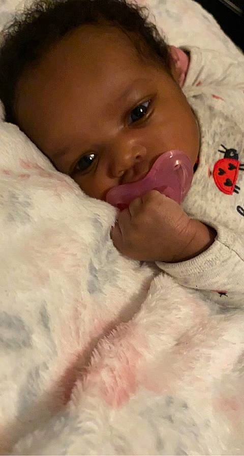 Jaliyah is registered to the contest to win money with this photo: arm, baby, baby_toddler_clothing, cheek, chin, comfort, ear, eye, eyebrow, eyelash, face, forehead, gesture, head, iris, lip, mouth, nose, person, pink