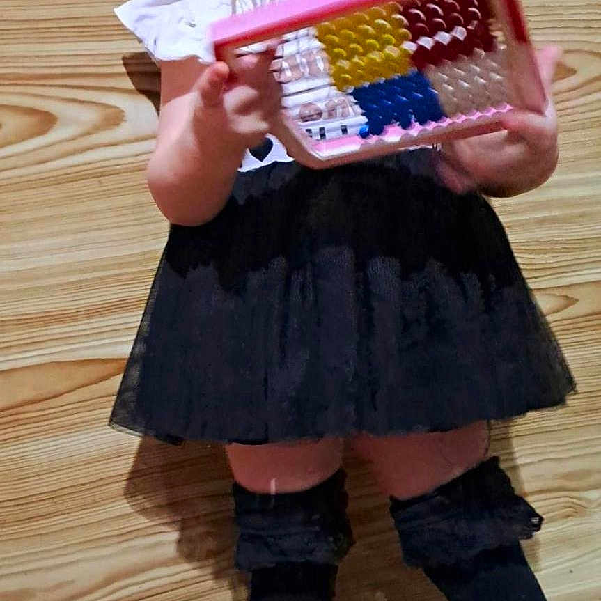 Emanuela participe au concours pour gagner de l'argent avec cette photo : child, clothing, face, female, footwear, girl, grater, gratingfood, head, hosiery, kitchenutensil, person, photography, portrait, racket, shoe, sock, sport, tennis, tennisracket
